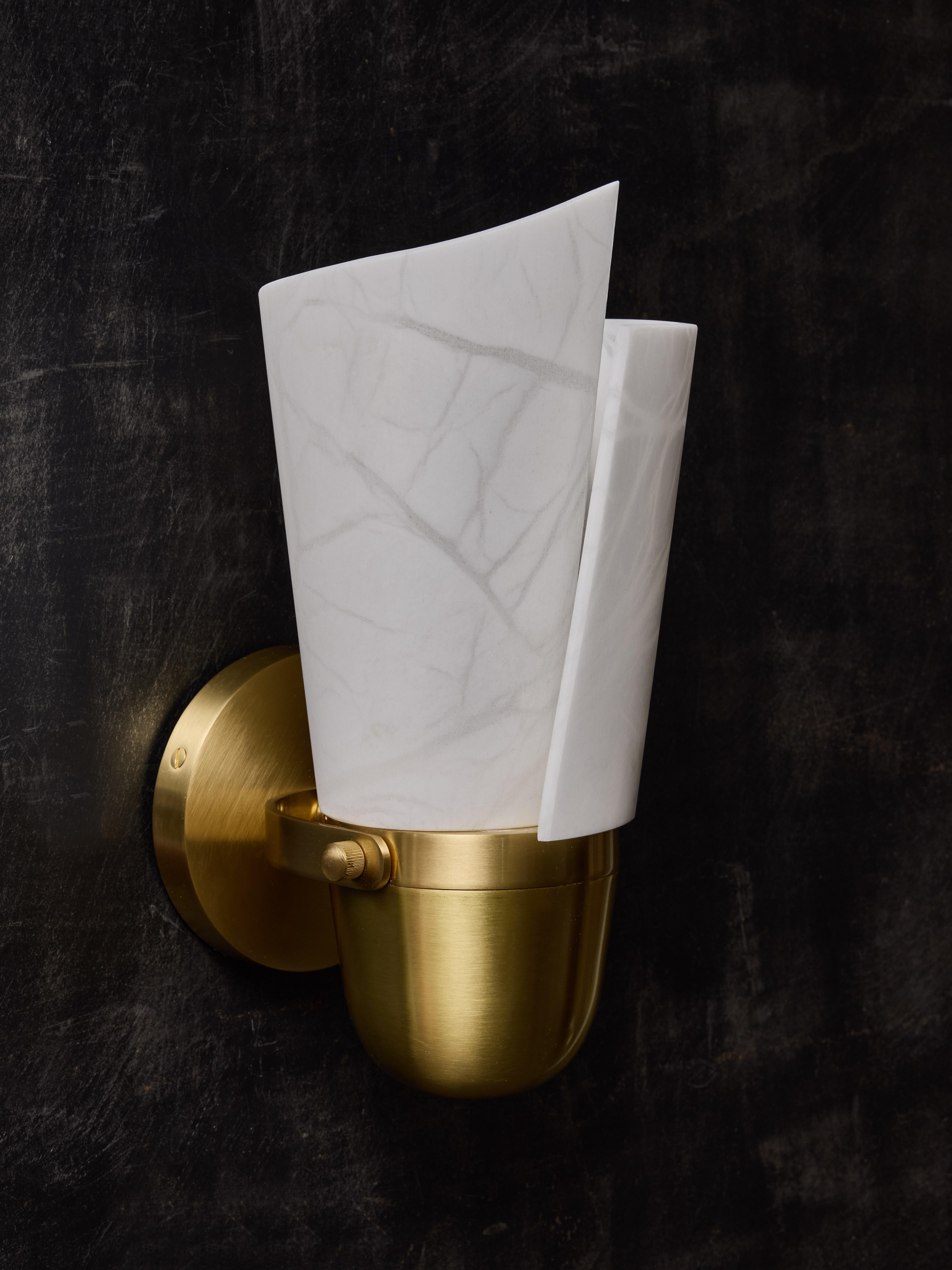 Adjustable satinated brass wall sconces with new spiral shaped alabaster diffuser.