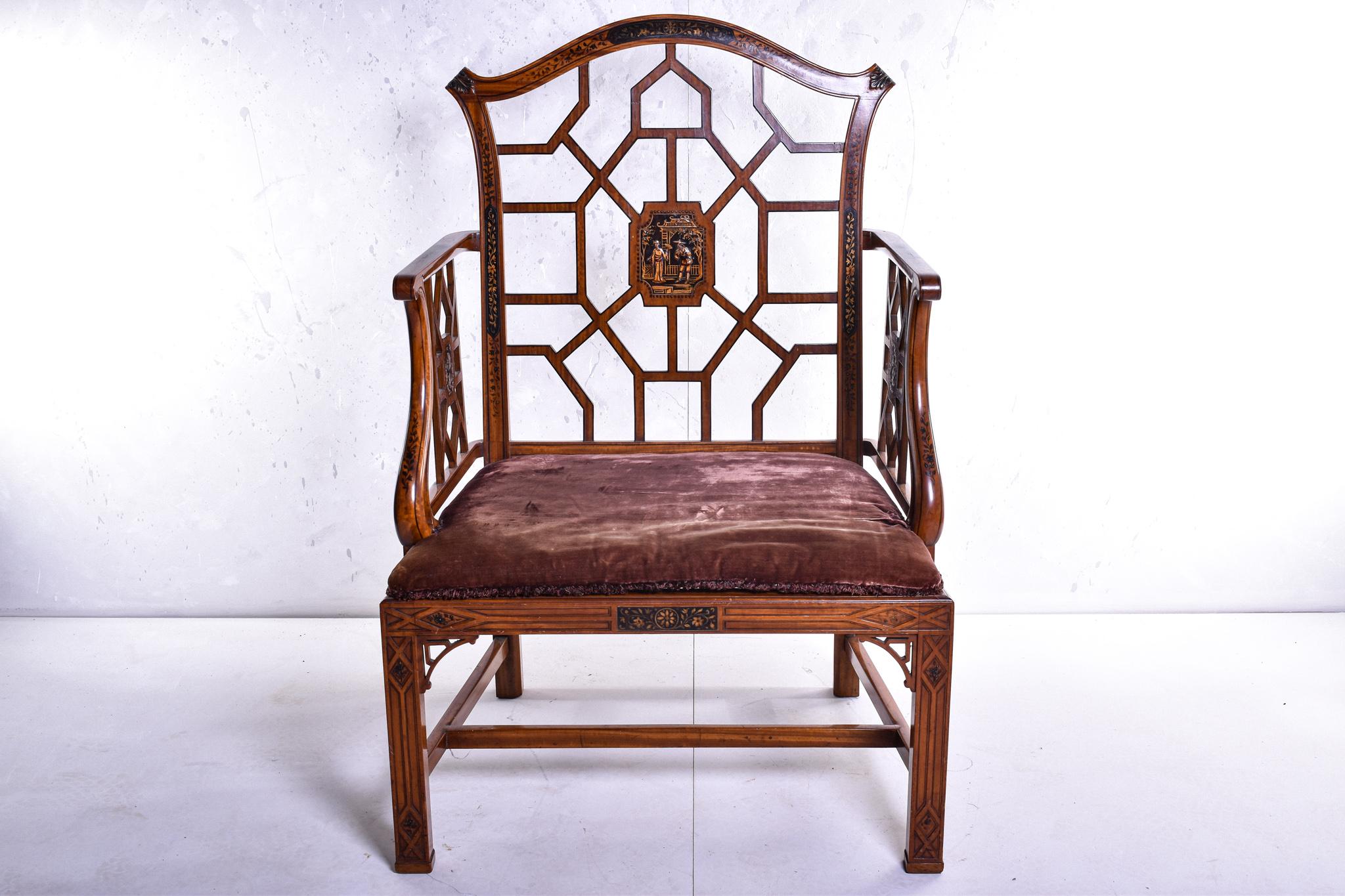 A simply wonderful satinwood armchair by Hille & Co, in the 'Chinese' taste, designed and crafted to the highest grade. The arched back centred with a Chinoiserie scene, painted arms with lattice supports above a caned seat with velvet cushion above