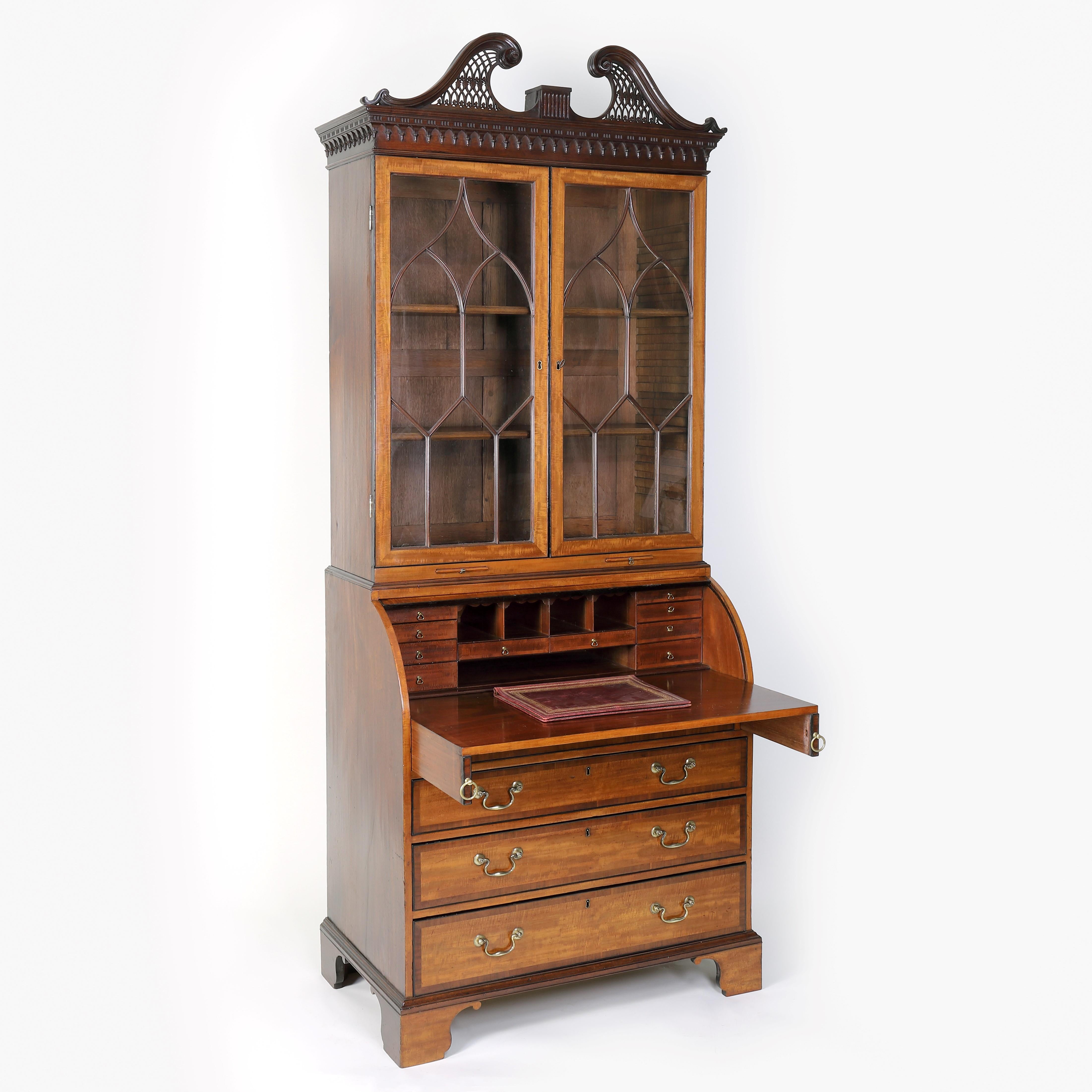 An exceptional and remarkable late 18th century satinwood and mahogany cylinder bureau bookcase of outstanding quality and attributable to Thomas Shearer.
This magnificent bookcase is constructed to the highest standards of craftsmanship, with