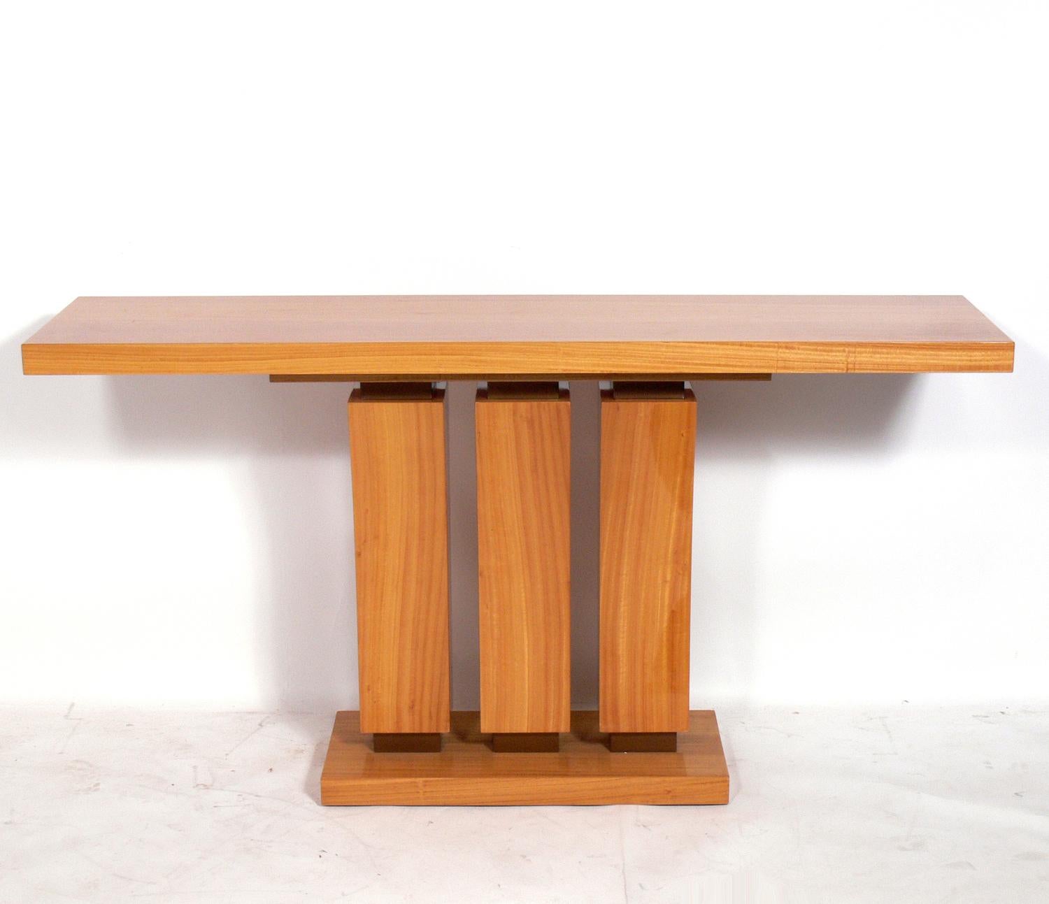 Satinwood console table, American, circa 1990s. This is based on a French Art Deco design from the 1930s. Beautiful graining to the satinwood. It is a versatile size and can be used as a console table, sofa table, or bar. We have a pair available.