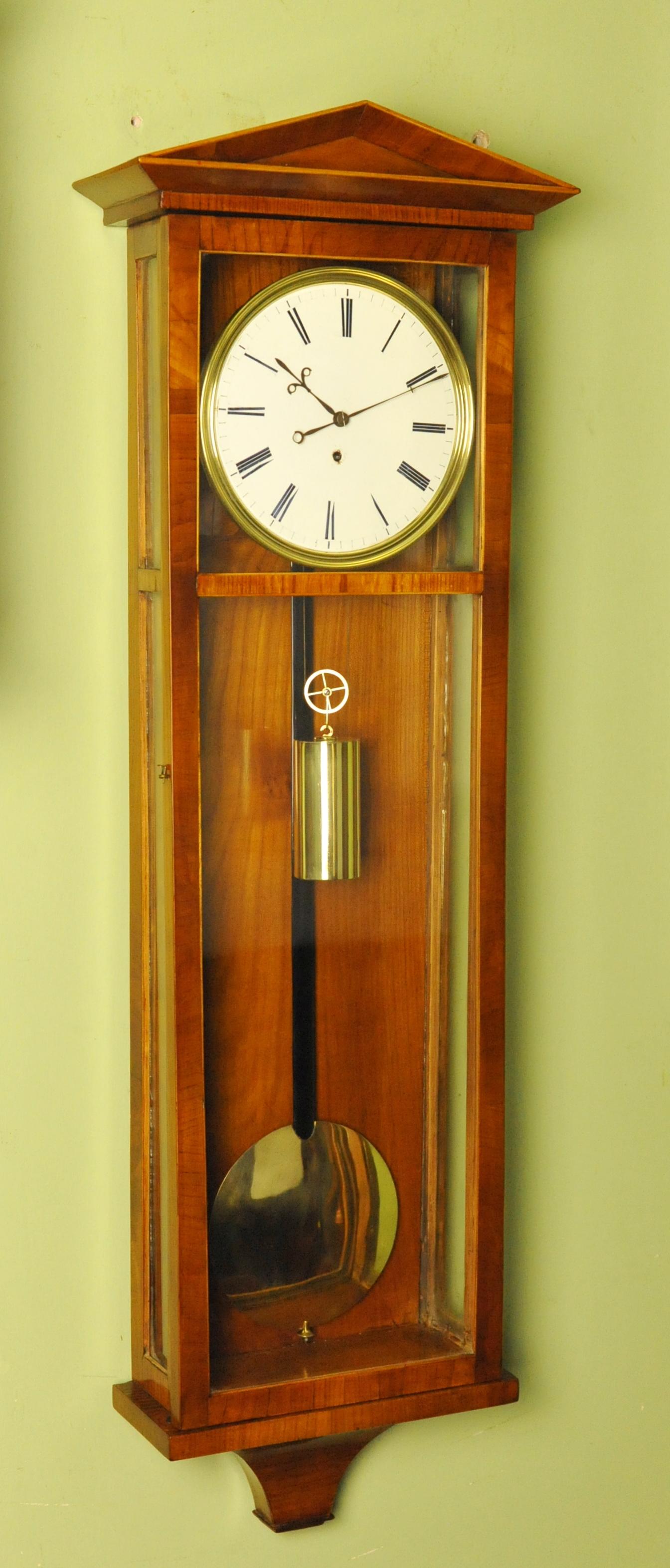 It is a pleasure to offer this very fine true Vienna regulator wall antique clock made circa 1840 with a beautiful and rare satinwood case
It is beautiful made and has very elegant and restrained proportions being of the Dachluhr (rooftop)