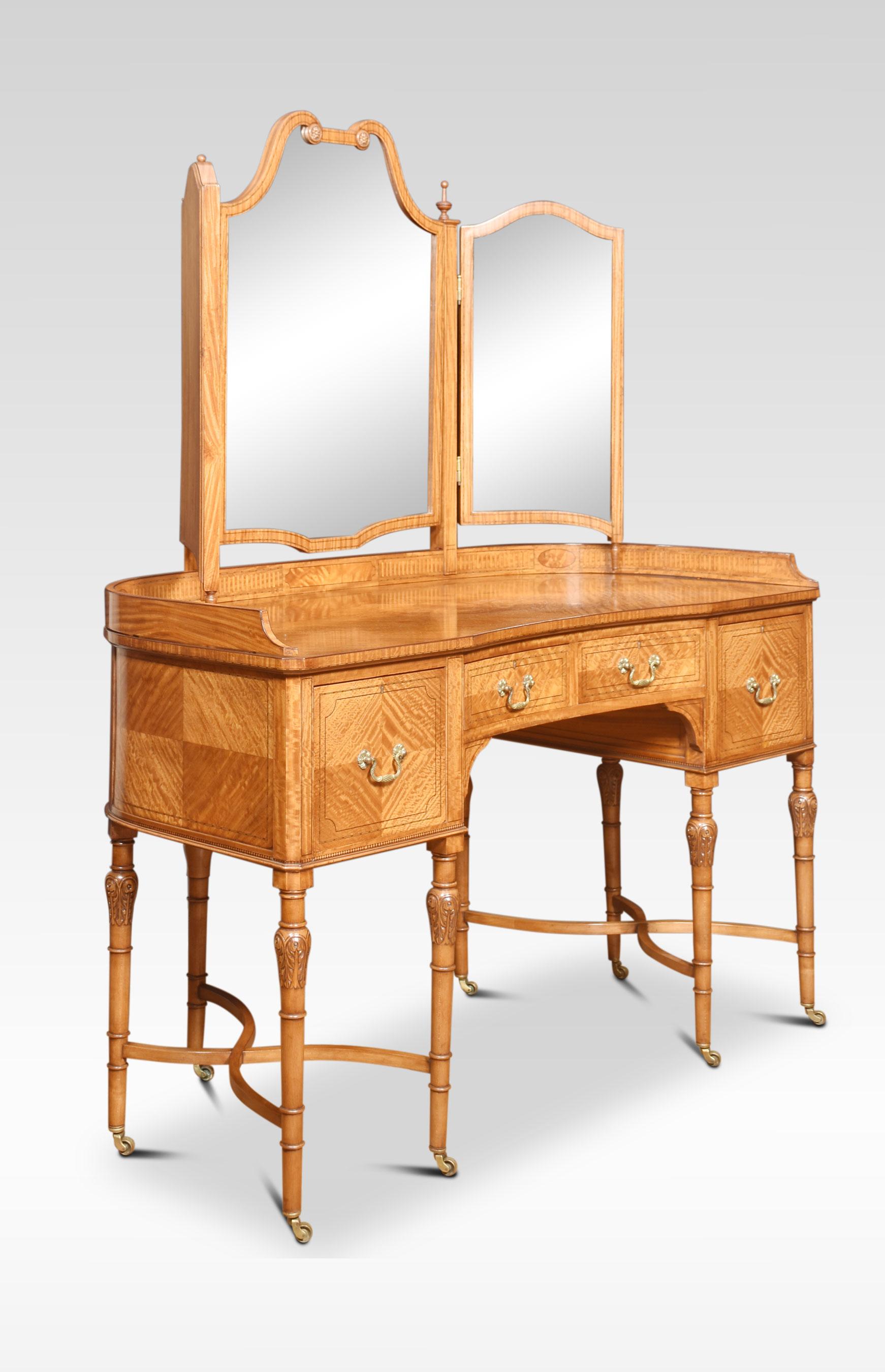 Satinwood string inlaid dressing table, having adjustable superstructure with urn capitals. To the central-shaped mirror having smaller mirrors on either side. Above the base section with a large well figured top to the freeze fitted with an