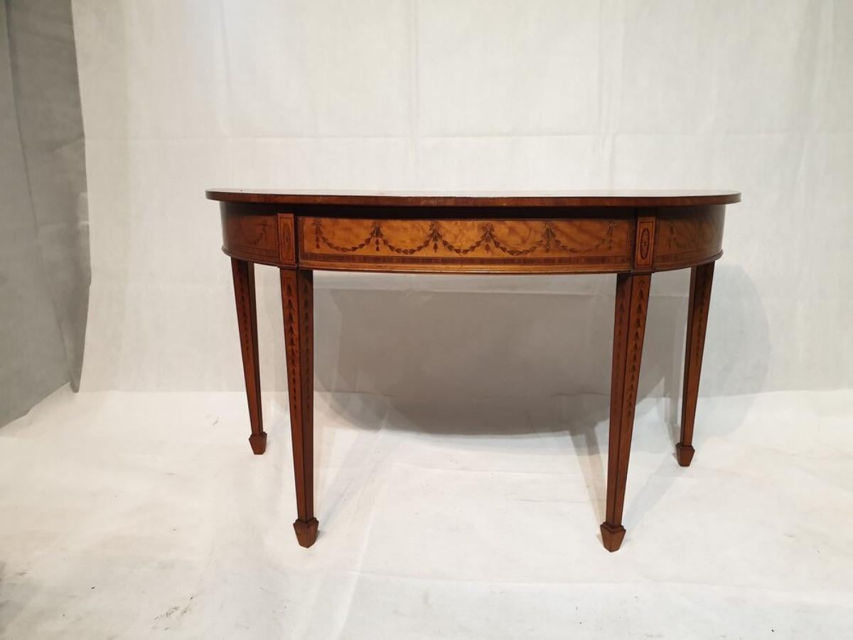 An extremely fine English Satinwood Pier table, this piece is profusely decorated and finely inlaid with fruit woods and depicting garlands of flowers and images of scenes and portraits etc.
The quality is exquisite the same as the colour and its