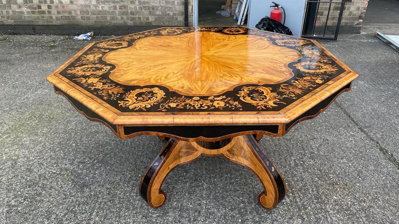 Satinwood & Kingwood Victorian ebony inlay octagonal table, 19th century.

The top with beautifully figured and deeply coloured satinwood inlaid with bands of kingwood and finished to the perimeter with gadrooning of ebony inlay. A beautiful piece