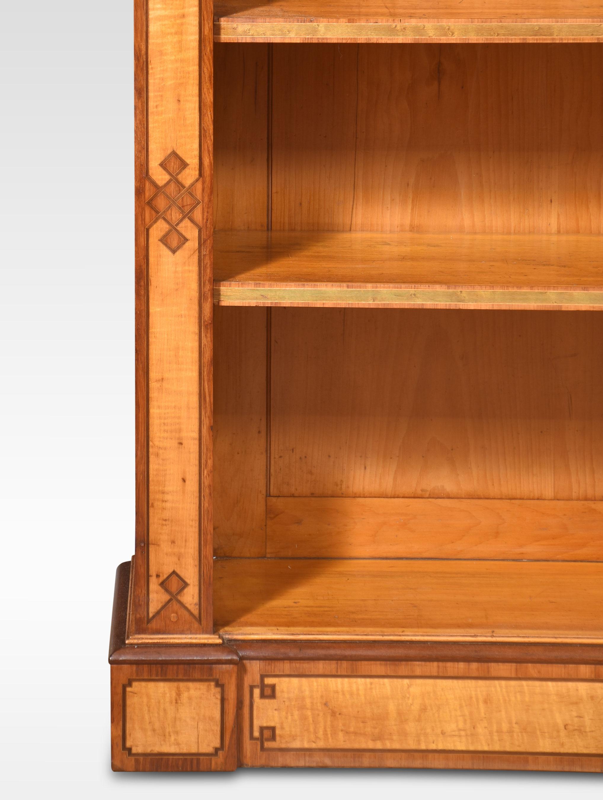 Satinwood open bookcase By C Hindley & Sons, the large rectangular top with inlaid detail and moulded edge to the adjustable shelved interior flanked by further inlaid columns. All raised up on a plinth base.
Dimensions
Height 40 Inches
Width 56