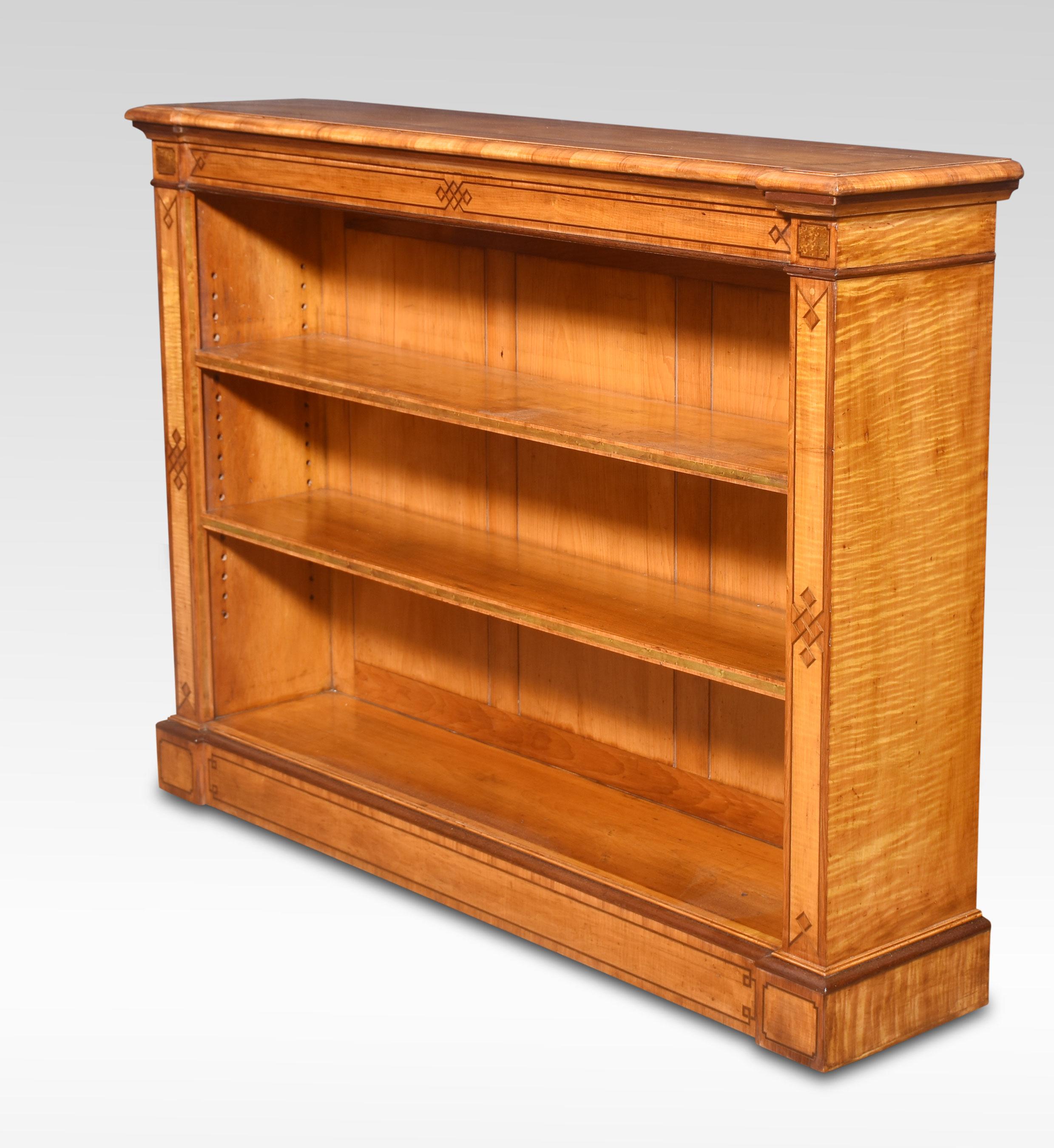 British Satinwood open bookcase By C Hindley and Sons