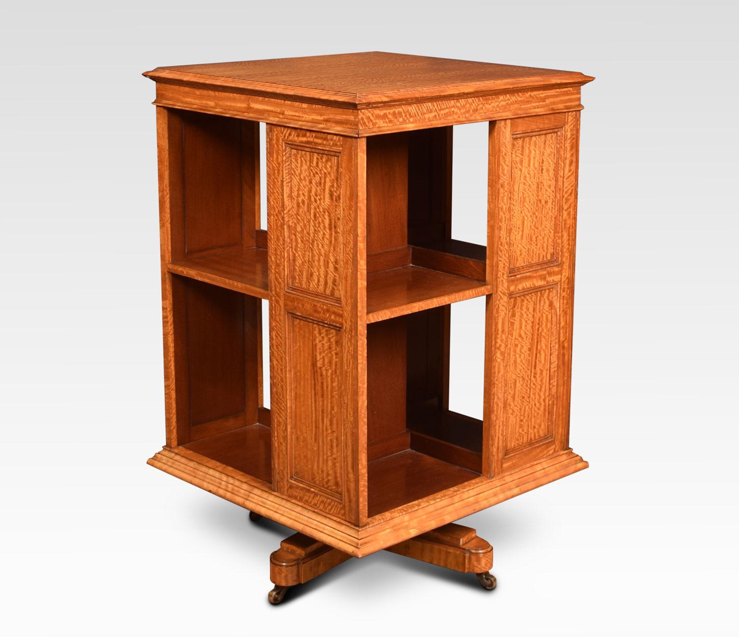 Satinwood revolving bookcase with moulded square top above two-tier panelled dividers. All raised up on cruciform base and brass castors.
Dimensions:
Height 35.5 inches
Width 22.5 inches
Depth 22.5 inches.