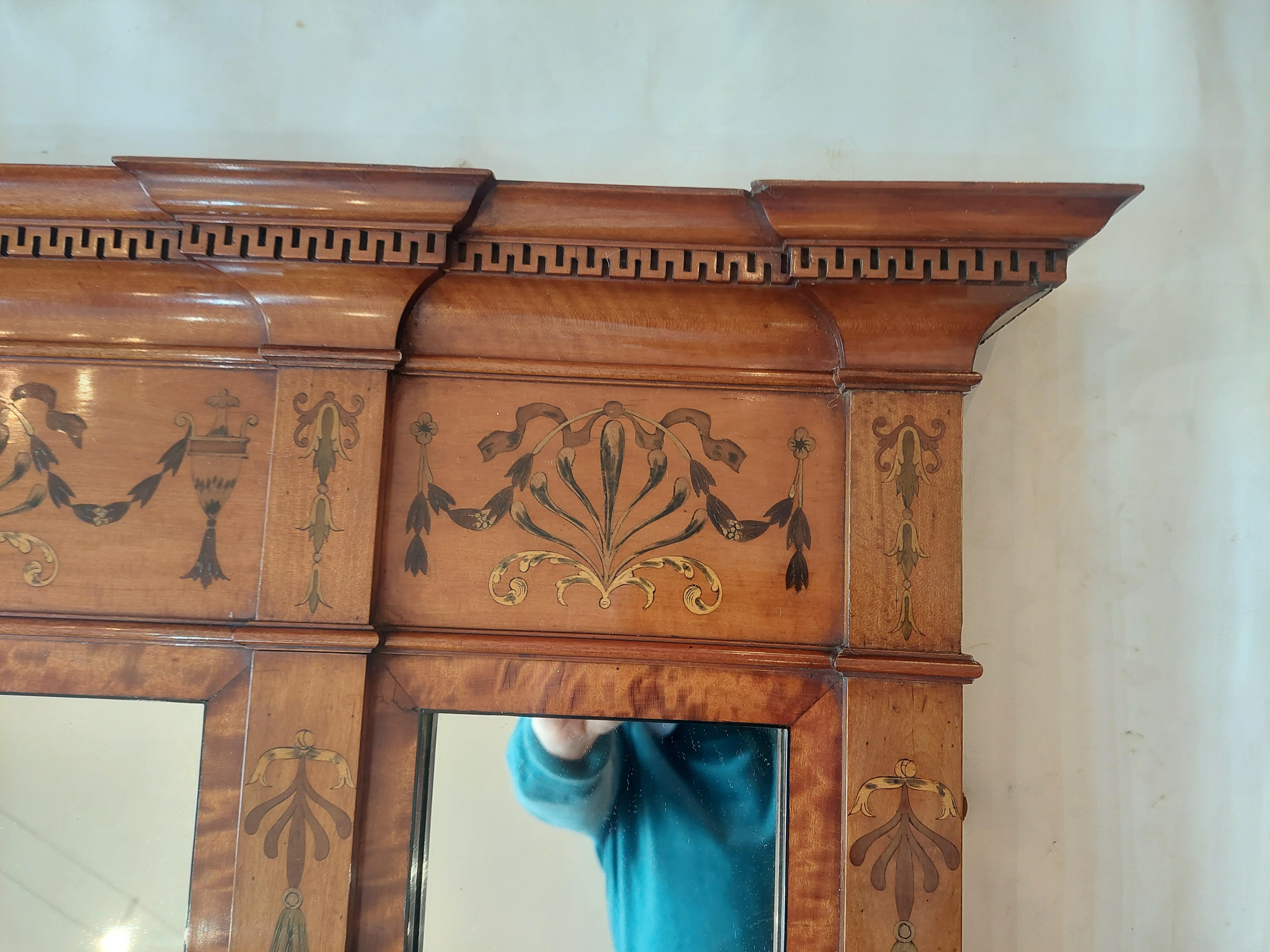 Satinwood Sheraton Style Over Mantel Mirror
late 19thC the moulded Greek key pattern pediment over a frieze inlaid with harebell swags and urns above  triptych mirror 64