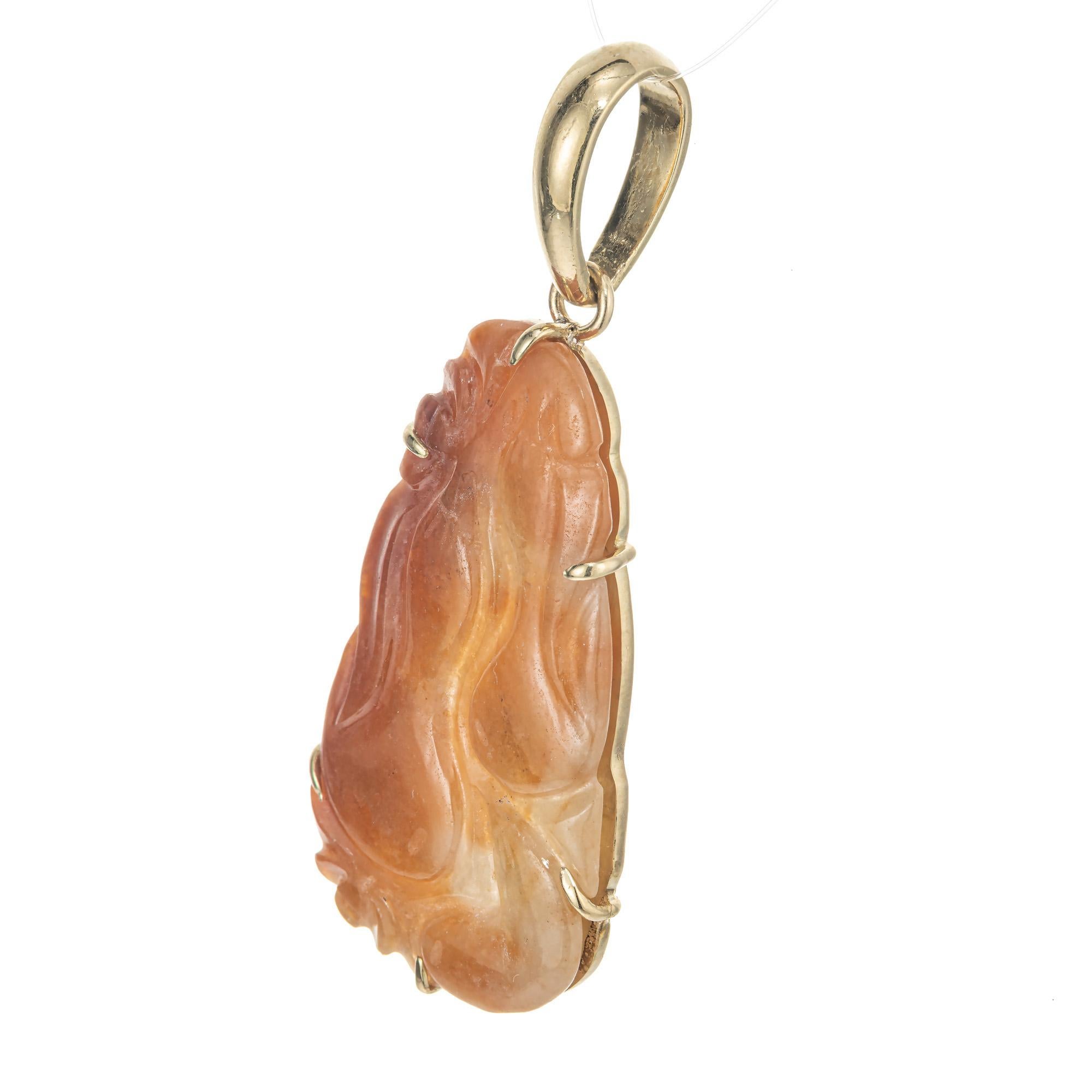 GIA Certified Deep Reddish orange hand carved natural untreated Jadeite Jade pendant. Set in a 18k yellow gold frame signed Satsky with a large substantial bail to accommodate larger chains.  

1 fancy carved mottled reddish orange translucent