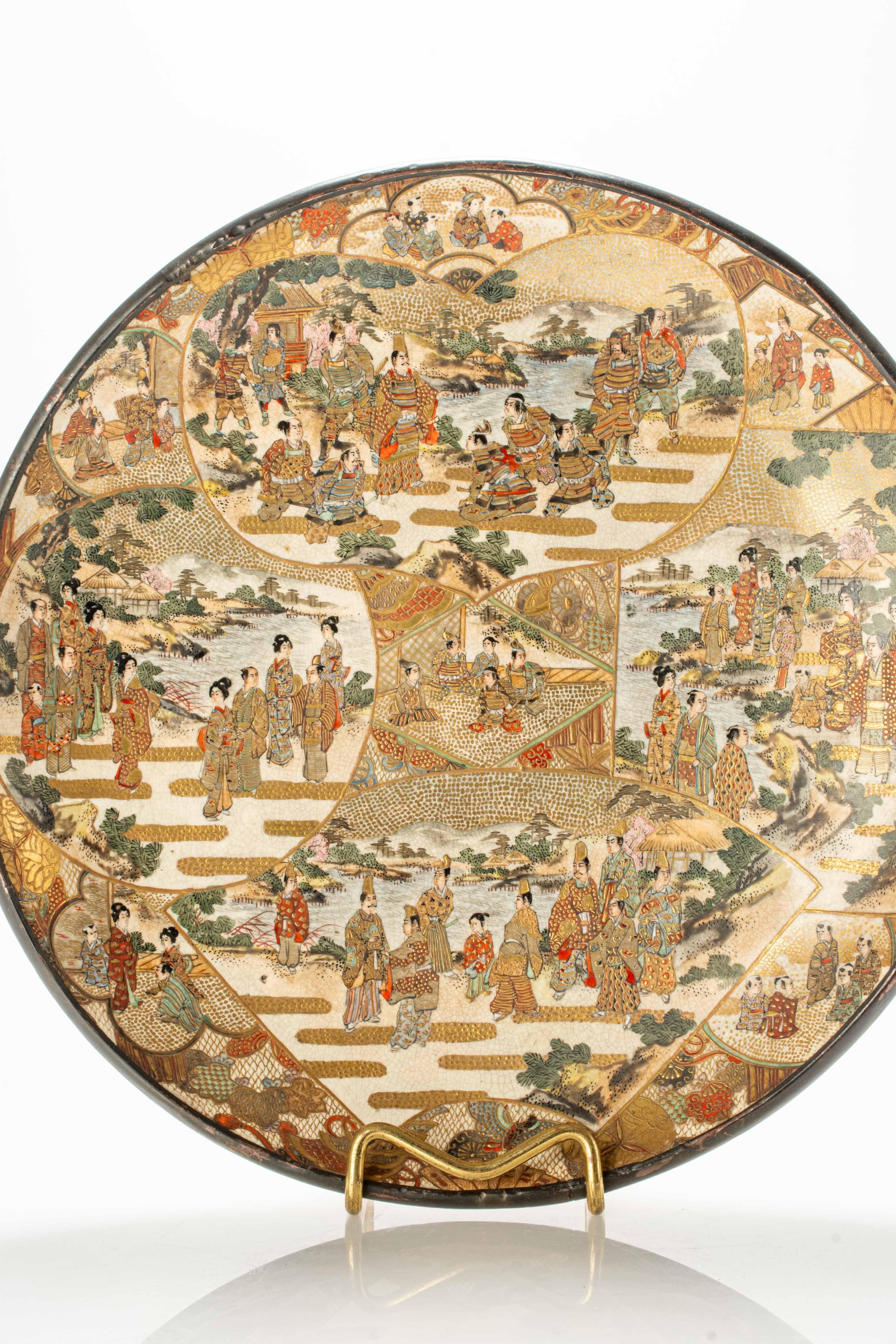 Satsuma ceramic plate adorned with polychrome and gold decorations within numerous reserves of unique shape and size, depicting scenes of Japanese daily life.

The plate is signed under the base 'Dai Nihon Yokohama Hotoda shōten seizō'.

Origin: