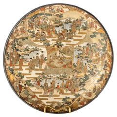 Antique Satsuma ceramic plate adorned with polychrome and gold decorations