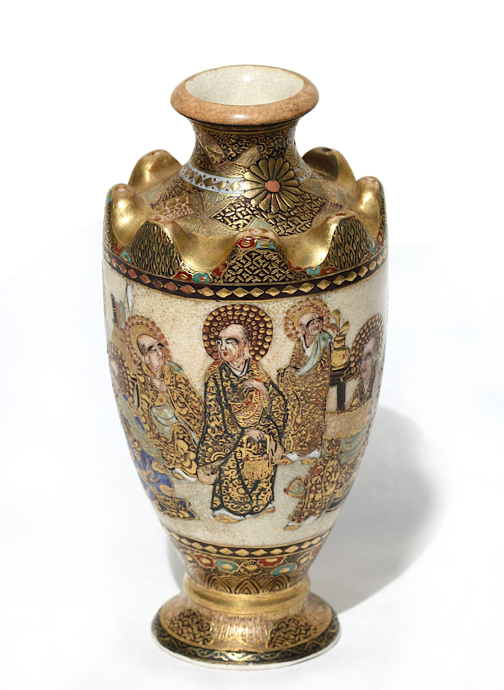 Satsuma earthenware cabinet vase, early 20th century. Decorated with immortals, signed.
Height 4.25 in. (10.79 cm.), by 2.5 in. (6.35 cm.)