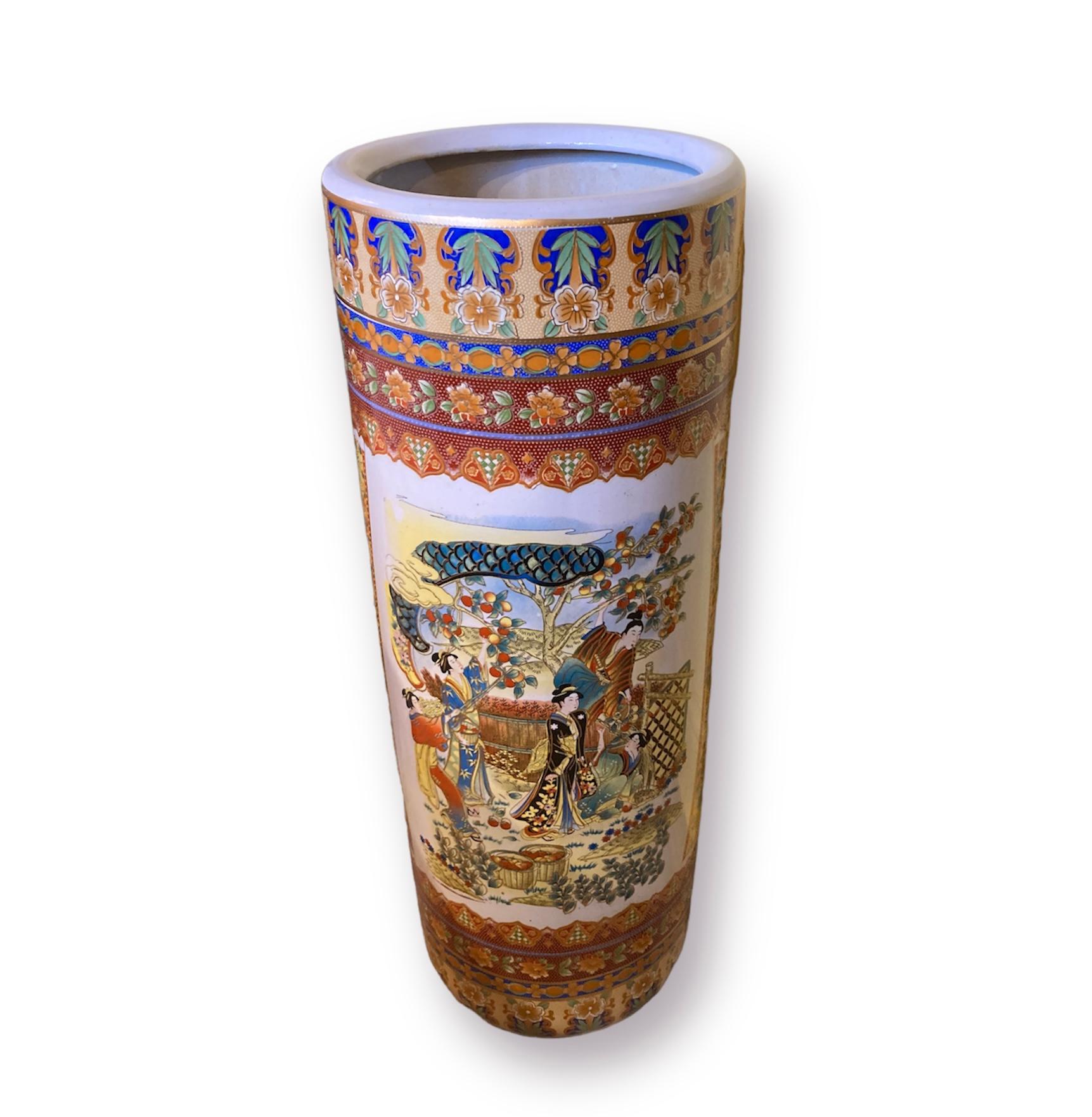 A beautiful oriental Satsuma stick and umbrella stand. Decorated all the way around depicting an elegant garden scene in rich oranges and blues.