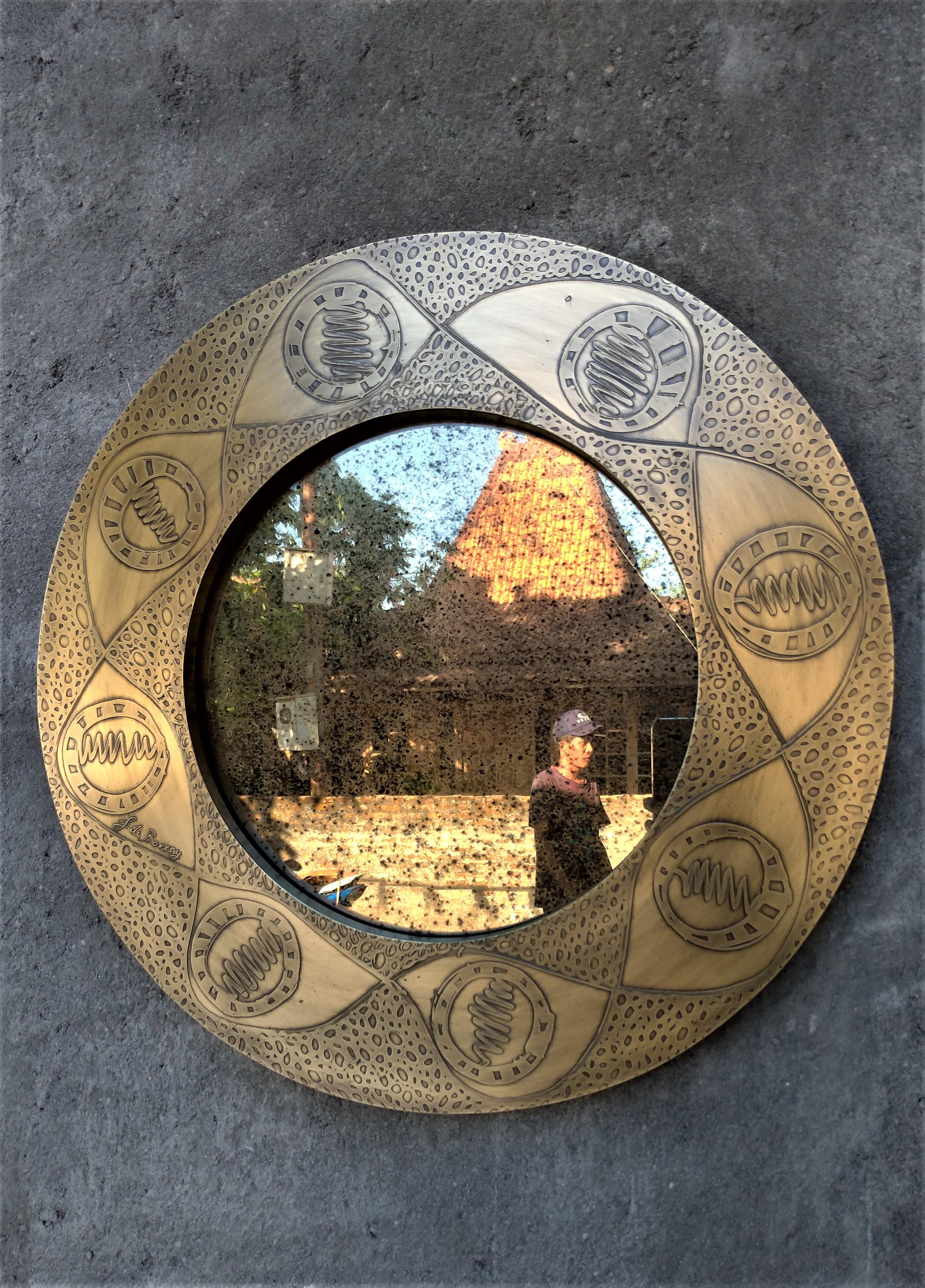 Unique small round 50 cm diameter wall mirror by Studio Belgali, handmade acid etched brass with hand drawn pattern combined with brownish antique mirror. 

Stunning piece of art. Custom made is possible.