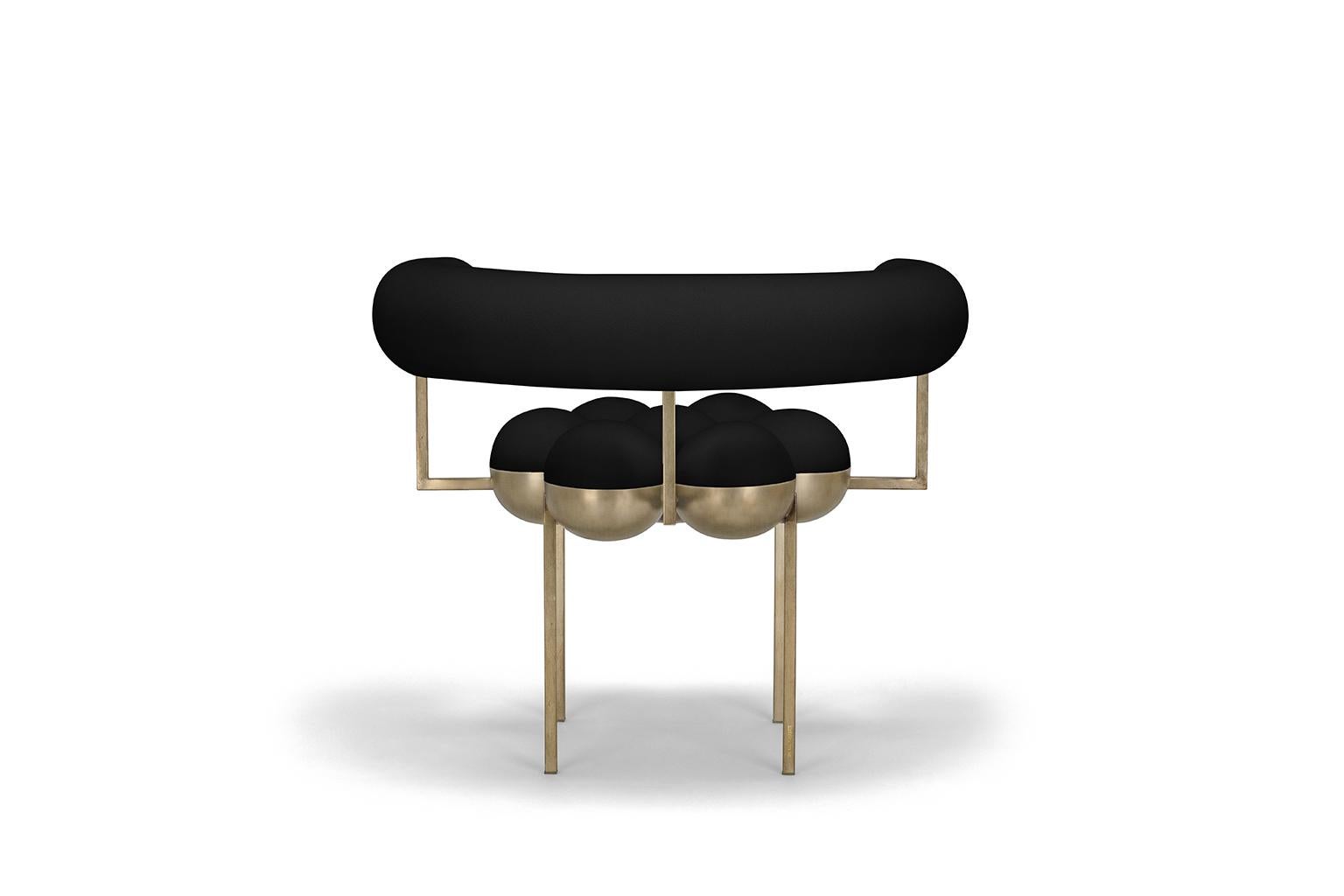 Saturn chair, black and bronze by Bohinc Studio. The distinctive Saturn chair is a return to the split sphere concepts Bohinc originally created for her jewelry collections such as sun and moon and solaris. This form has now evolved to create