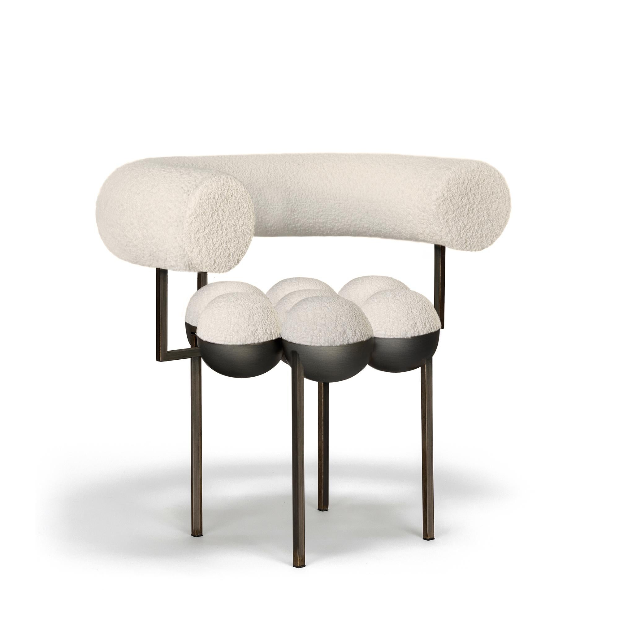 The distinctive Saturn chair is a return to the split sphere concepts Bohinc originally created for her jewelry collections such as Sun and Moon (2007) and Solaris (2012). This form has now been evolved to create bilboquet style ball and cup