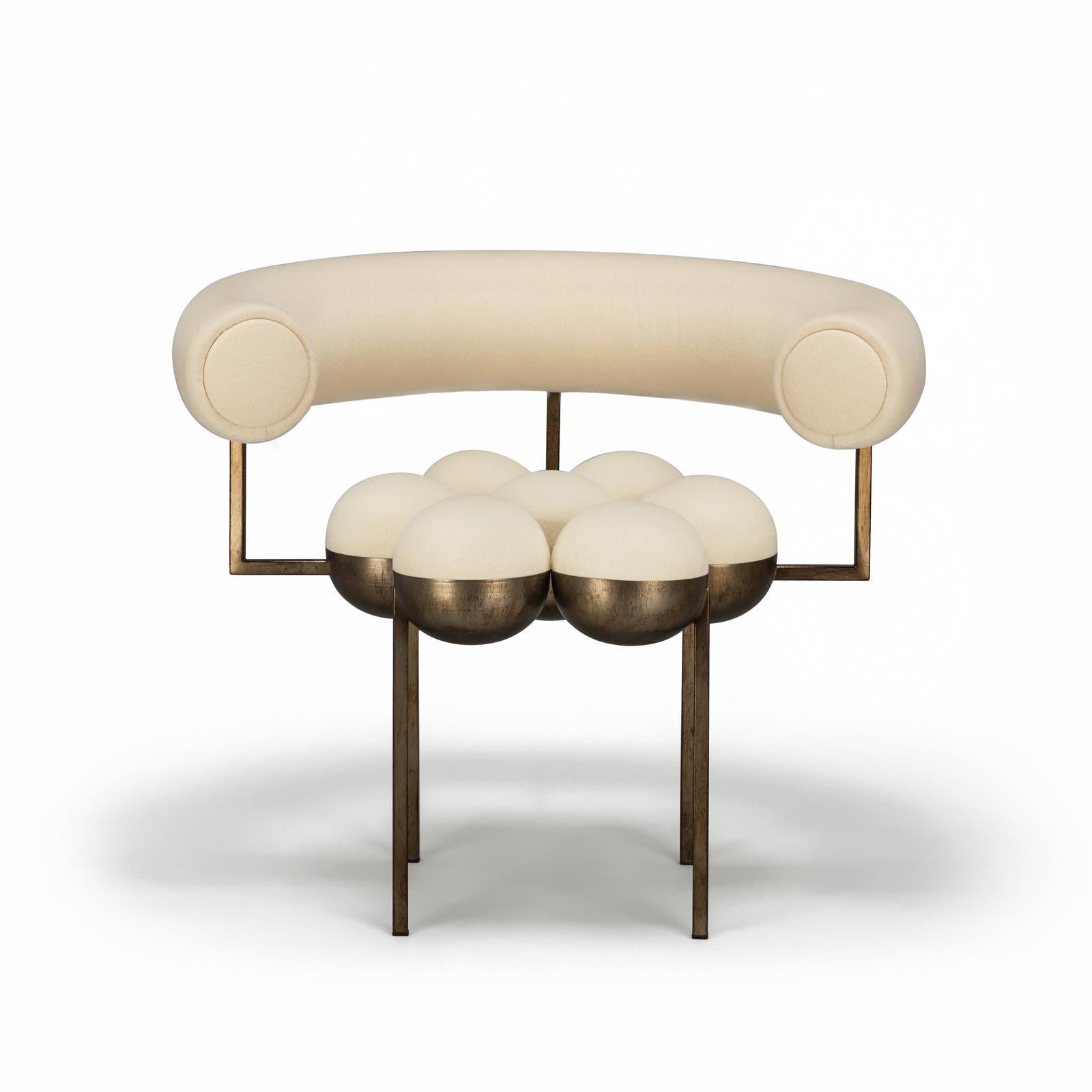 The distinctive Saturn chair is a return to the split sphere concepts Bohinc originally created for her jewellery collections such as Sun and Moon (2007) and Solaris (2012). This form has now been evolved to create bilboquet style ball and cup