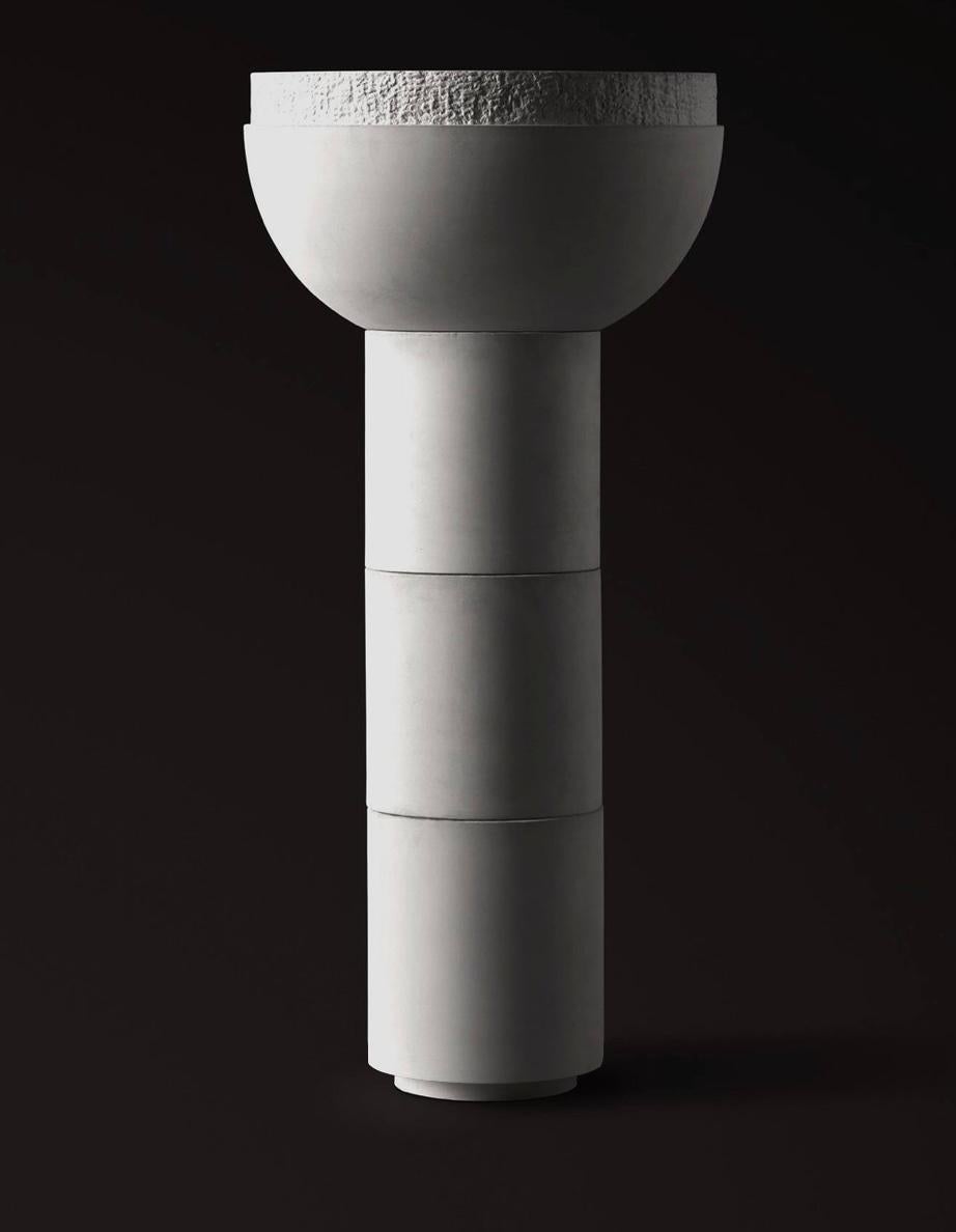 SATURN IV by Sirak. 
Footed Bowl Planter in Cast Concrete

The footed bowl planter is cast in super refined concrete that recalls dry porcelain. The planter is suitable for both interior and exterior settings and can be produced with or without a