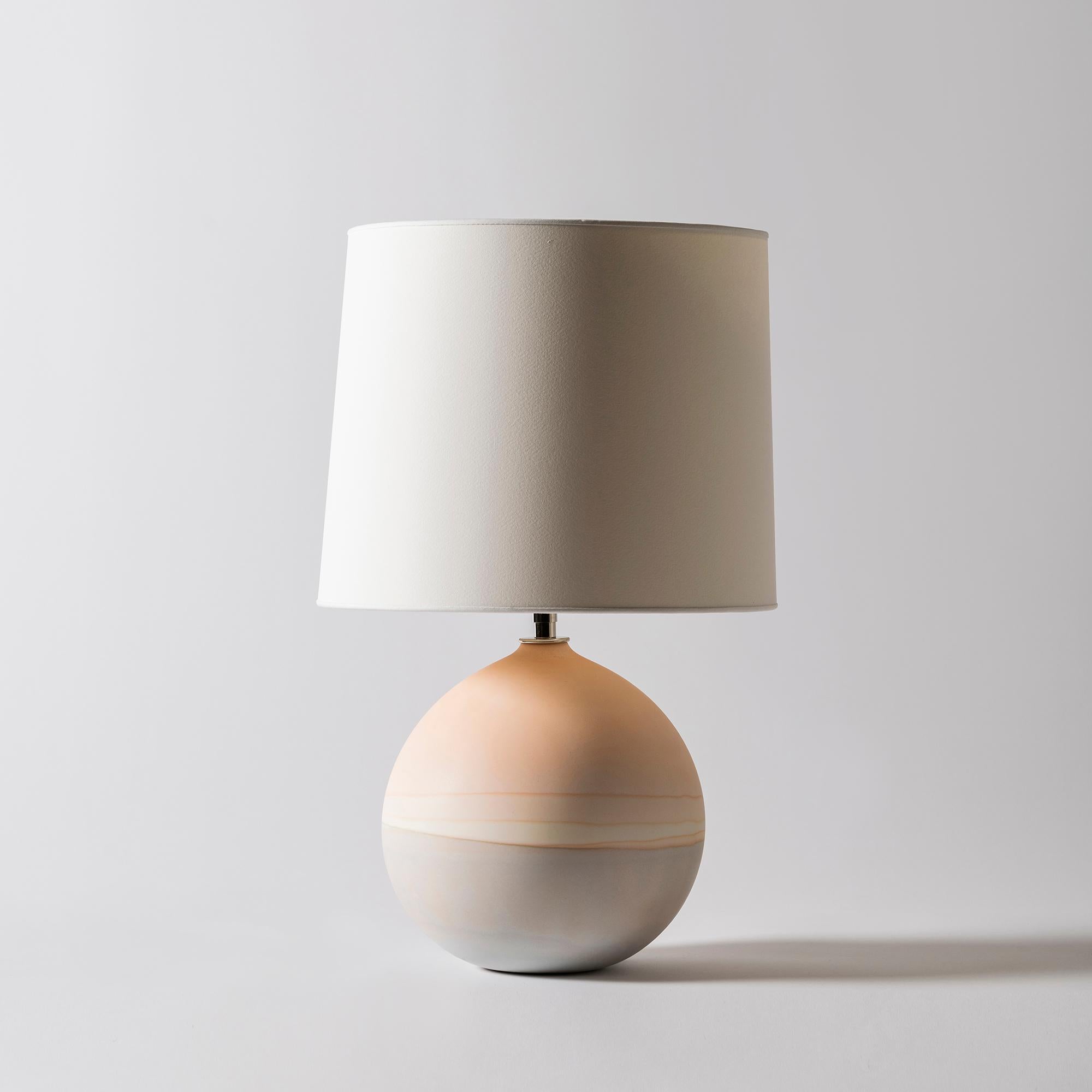 Saturn lamp in peach and sage by Elyse Graham
Dimensions: D 31 x H 49 cm
Materials: Plaster, Resin, Cotton rag Paper, brass, Nickel. Hardware: polished nickel-plated brass uno threaded socket
with turn key switch, in-line dimmer.
Molded, dyed,
