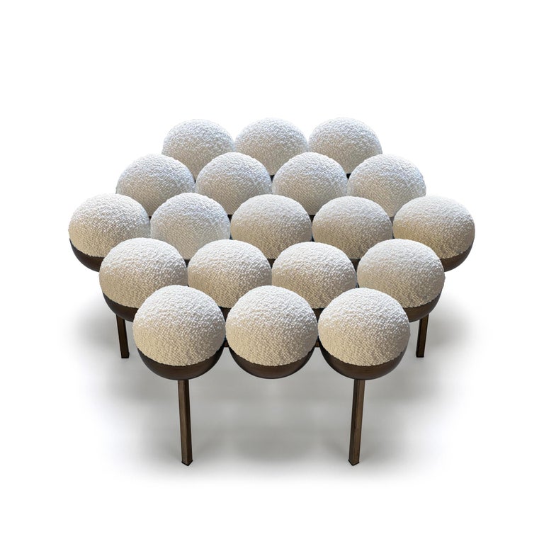 The equally singular Saturn pouffe utilises the same gathered bilboquet seat construction, to create a more simplified but still incredibly distinctive form. The sumptuously undulating seat instantly appeals with its invitingly upholstered comfort,