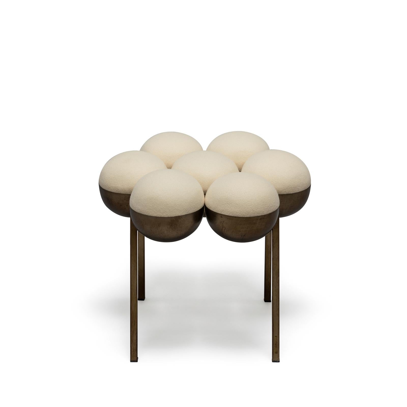 The equally singular Saturn pouffe utilises the same gathered bilboquet seat construction, to create a more simplified but still incredibly distinctive form. The sumptuously undulating seat instantly appeals with its invitingly upholstered comfort,