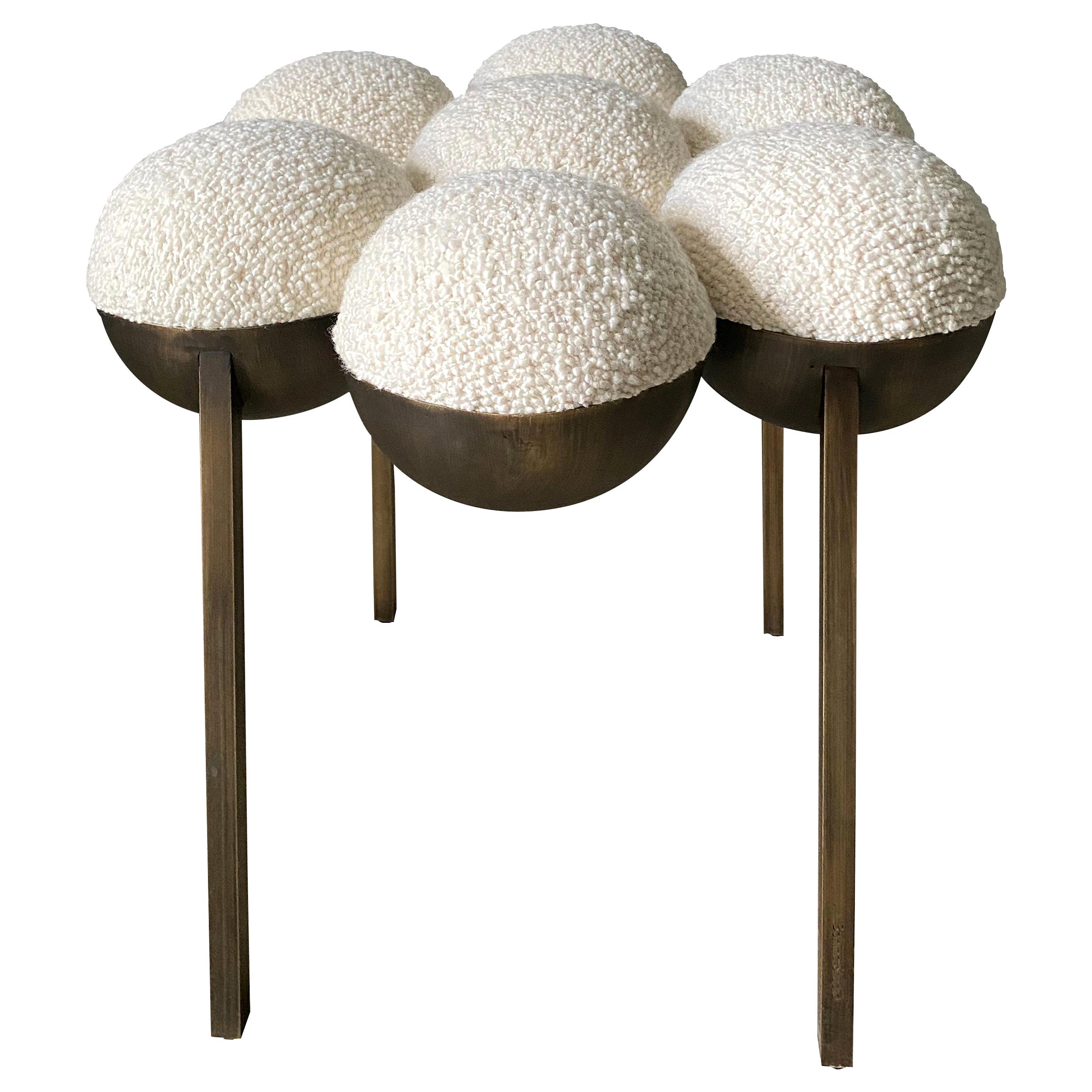 The Saturn pouffe utilizes gathered bilboquet seat construction, to create a more simplified but still incredibly distinctive form. The sumptuously undulating seat instantly appeals with its invitingly upholstered comfort, while the graceful