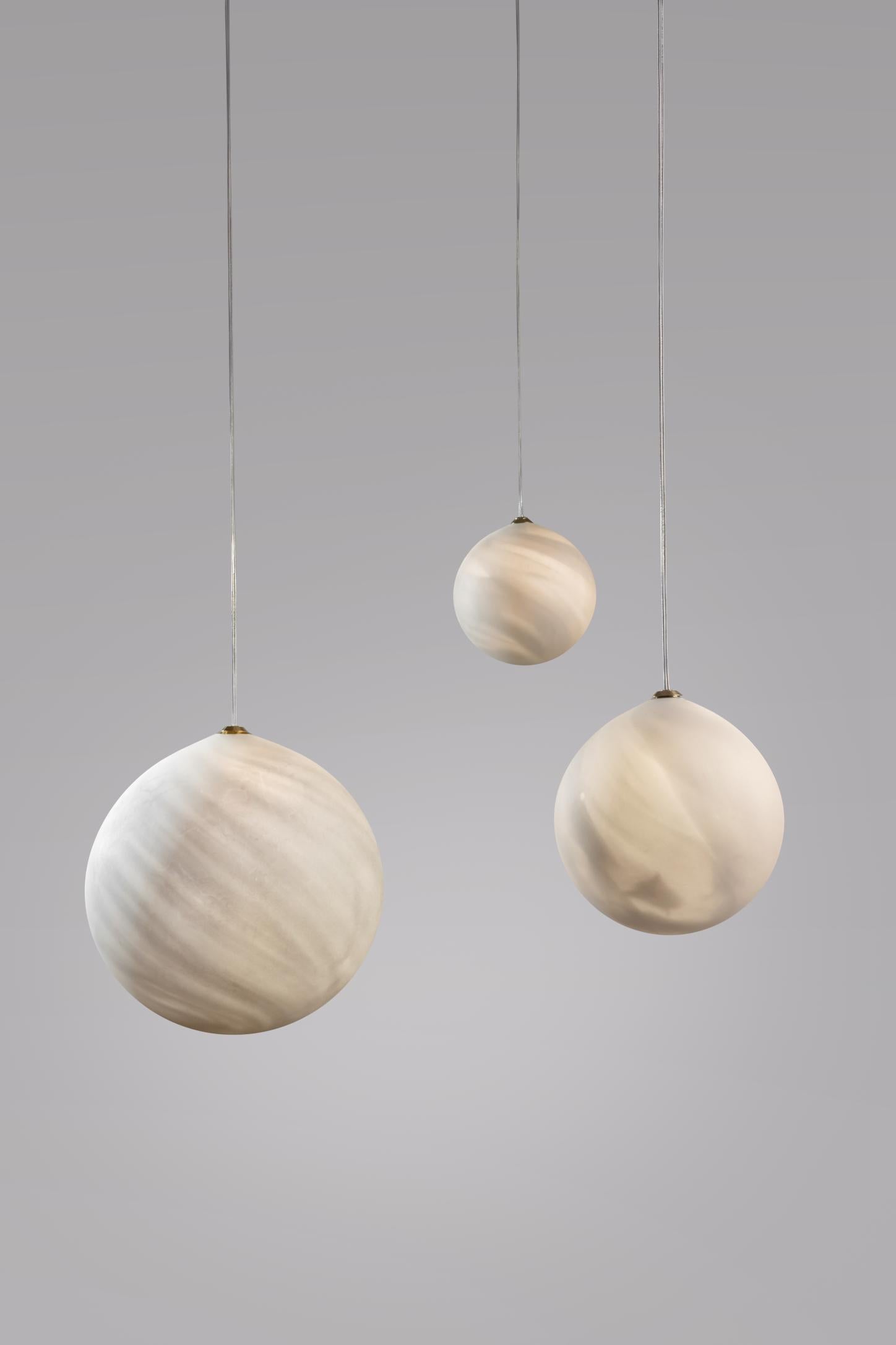 Saturne hanging lights planets, Ludovic Clément d’Armont
Every creation of Ludovic Clément d’Armont can be made to order in any requested dimensions.
Blown glass
Dimensions of the planets can vary in the following dimensions: 10 cm, 14 cm, 18 cm,