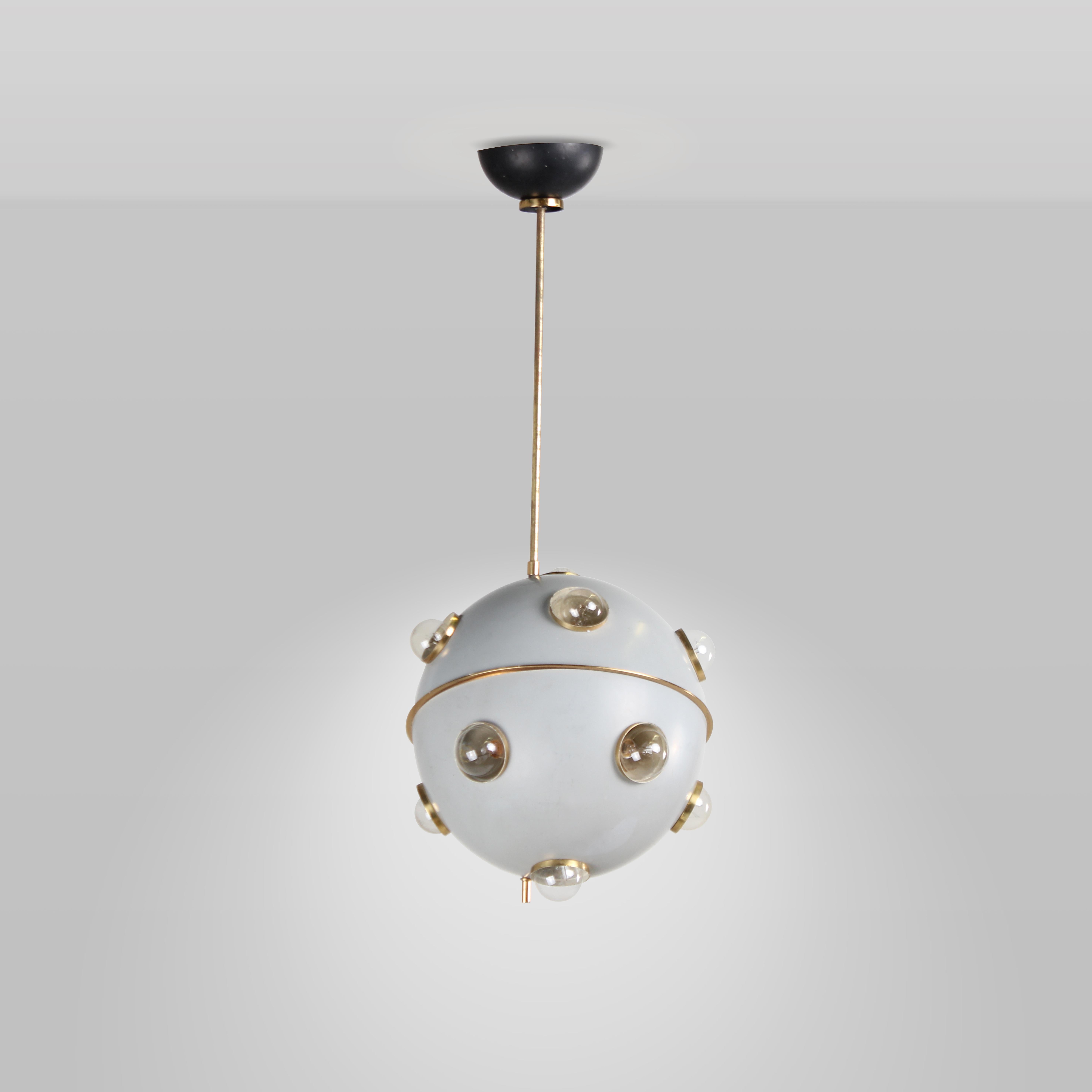 The Saturn chandelier is a exquisite and playful interior with a dreamlike and esoteric touch. Its impeccable craftsmanship in lacquered aluminum with polished brass, showcases Lumi's dedication to quality and style, typical of Italian design of the