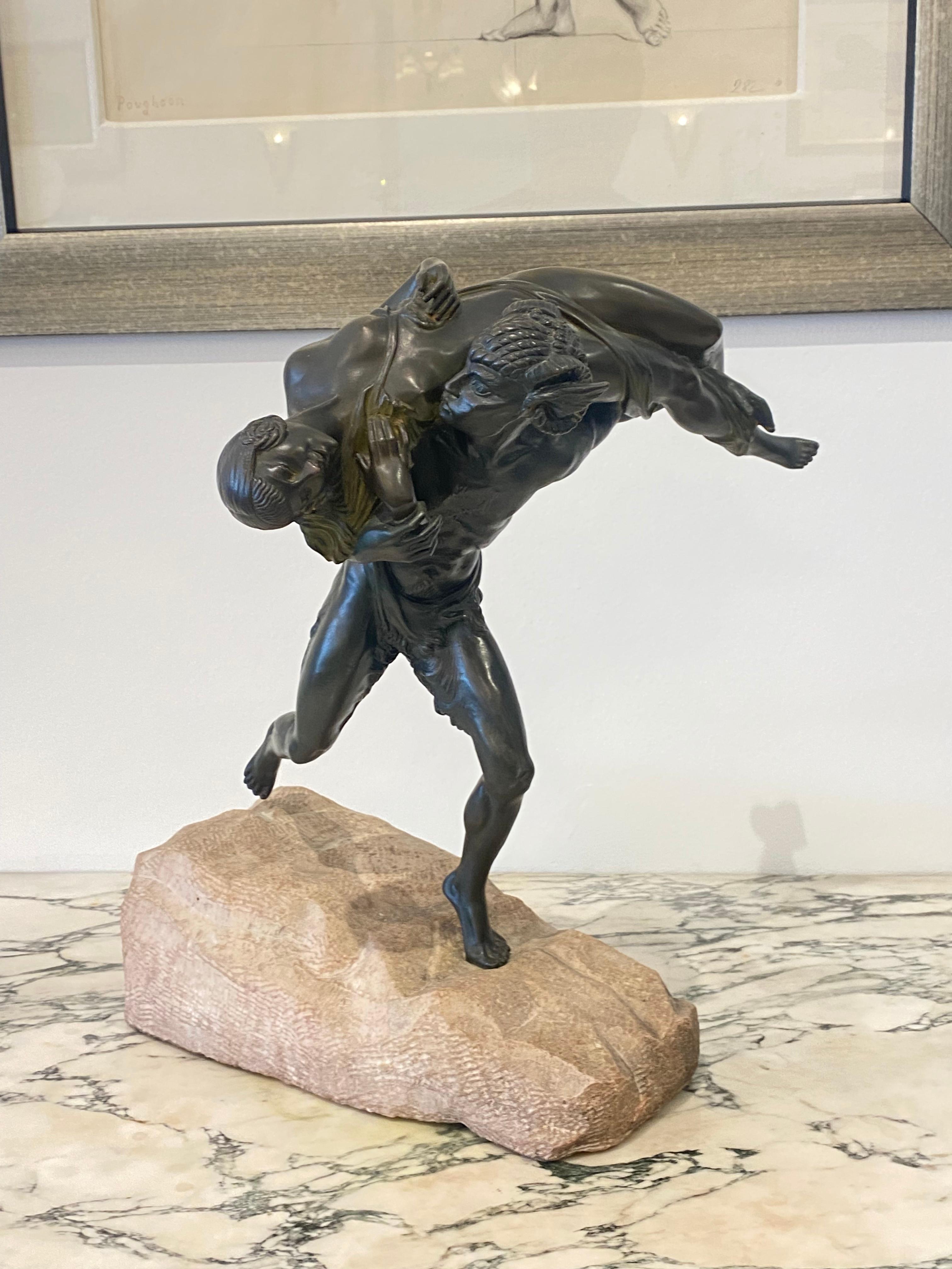 Sculpture Art Déco en bronze patiné à froid de Marcel-André Bouraine intitulée Satyre enlevant une nymphe. La pièce repose dans un rocher sculpté à la main.
Fabriqué en France 
Circa : 1930
Signature : A. Bouraine.