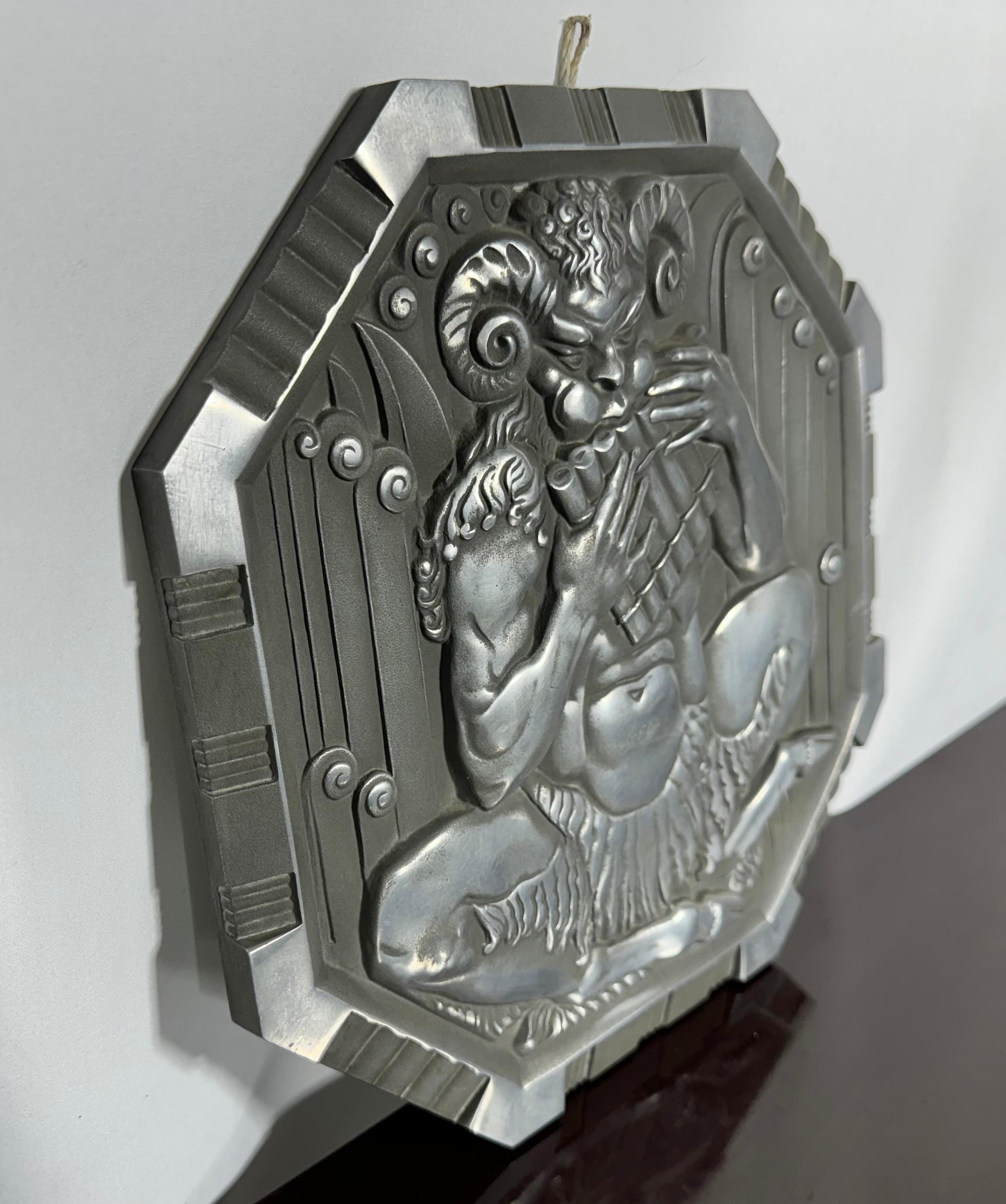 This rare and striking Art Deco bas relief panel, sculpted by Rene Chambellan, was commissioned and cast by the Aluminum Company of America, which we now know as Alcoa, to promote aluminum as an artistic and architectural medium. Chambellan was one