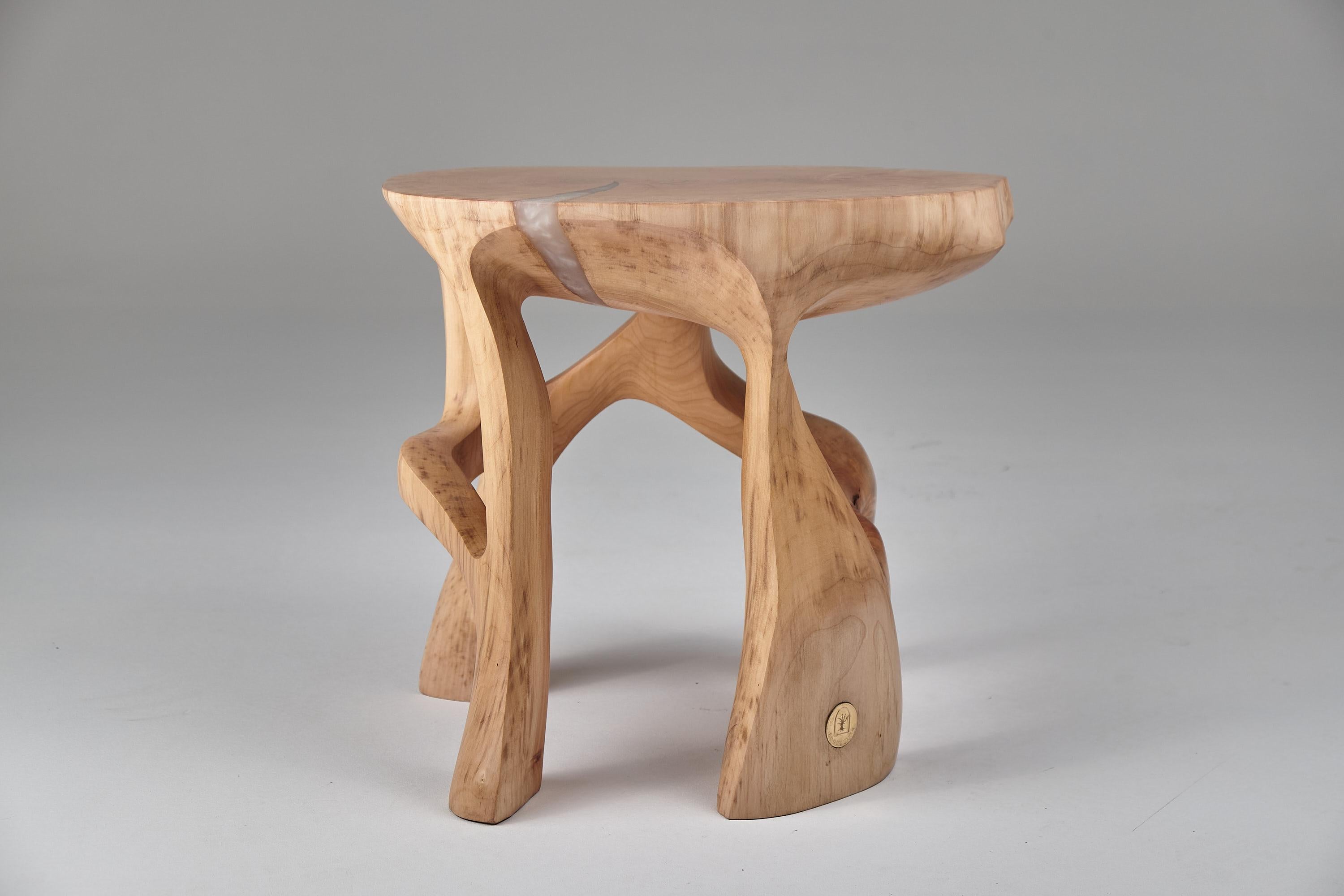 Unique functional sculpture carved from a single piece of wood in the shape of a side table, stool, night table or even pedestal. Each piece in our production is carved by artists with basic wood carving power tools. Every table is made as unique as