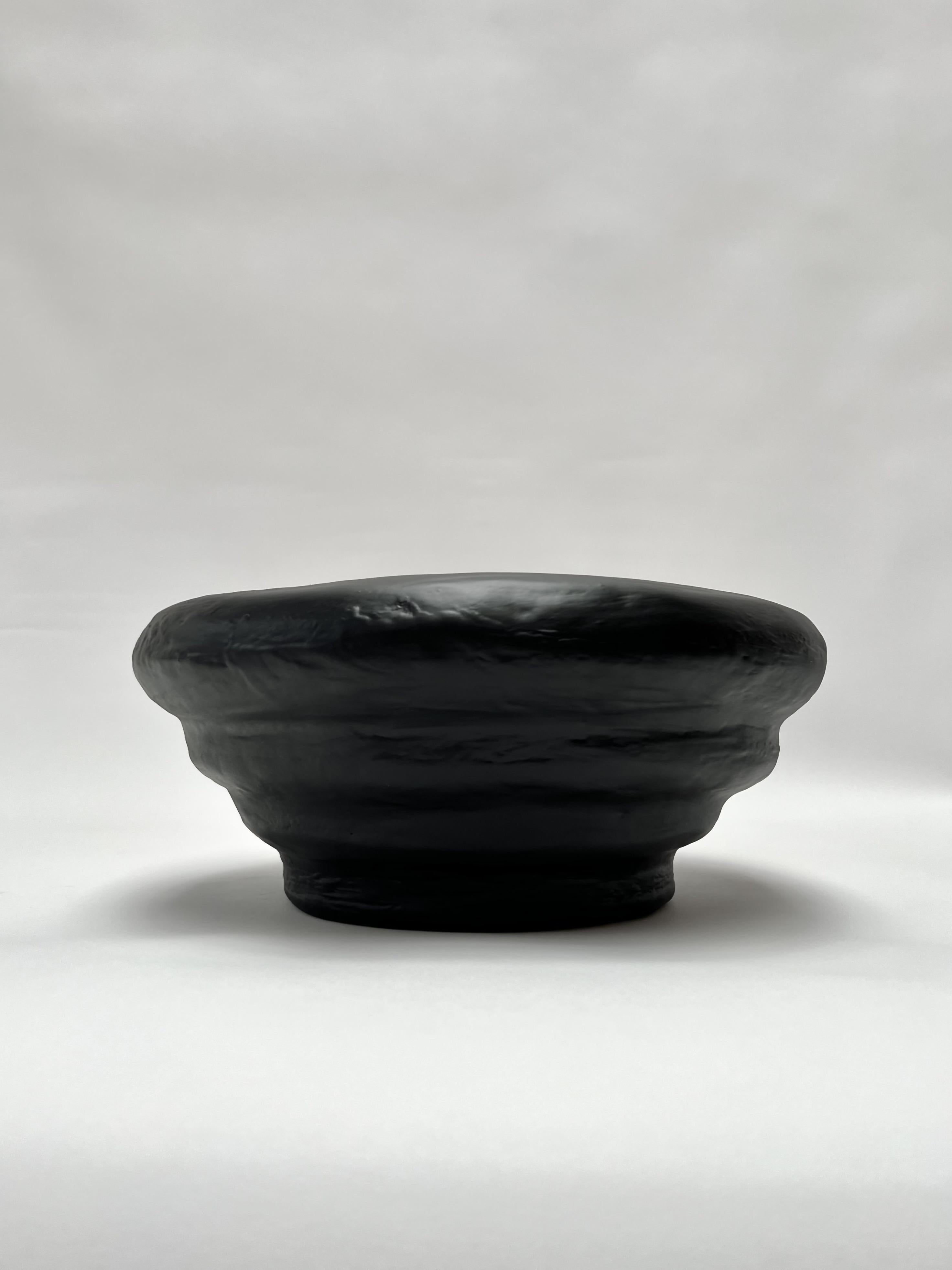 The Saucer Fruit Bowl by Brent Warr is a bold sculptural vessel that merges utility with expressive form. Featuring soft, concentric curves and a deep basin, the piece is hand-shaped with a proprietary gypsum and epoxy blend, then sealed in a sleek