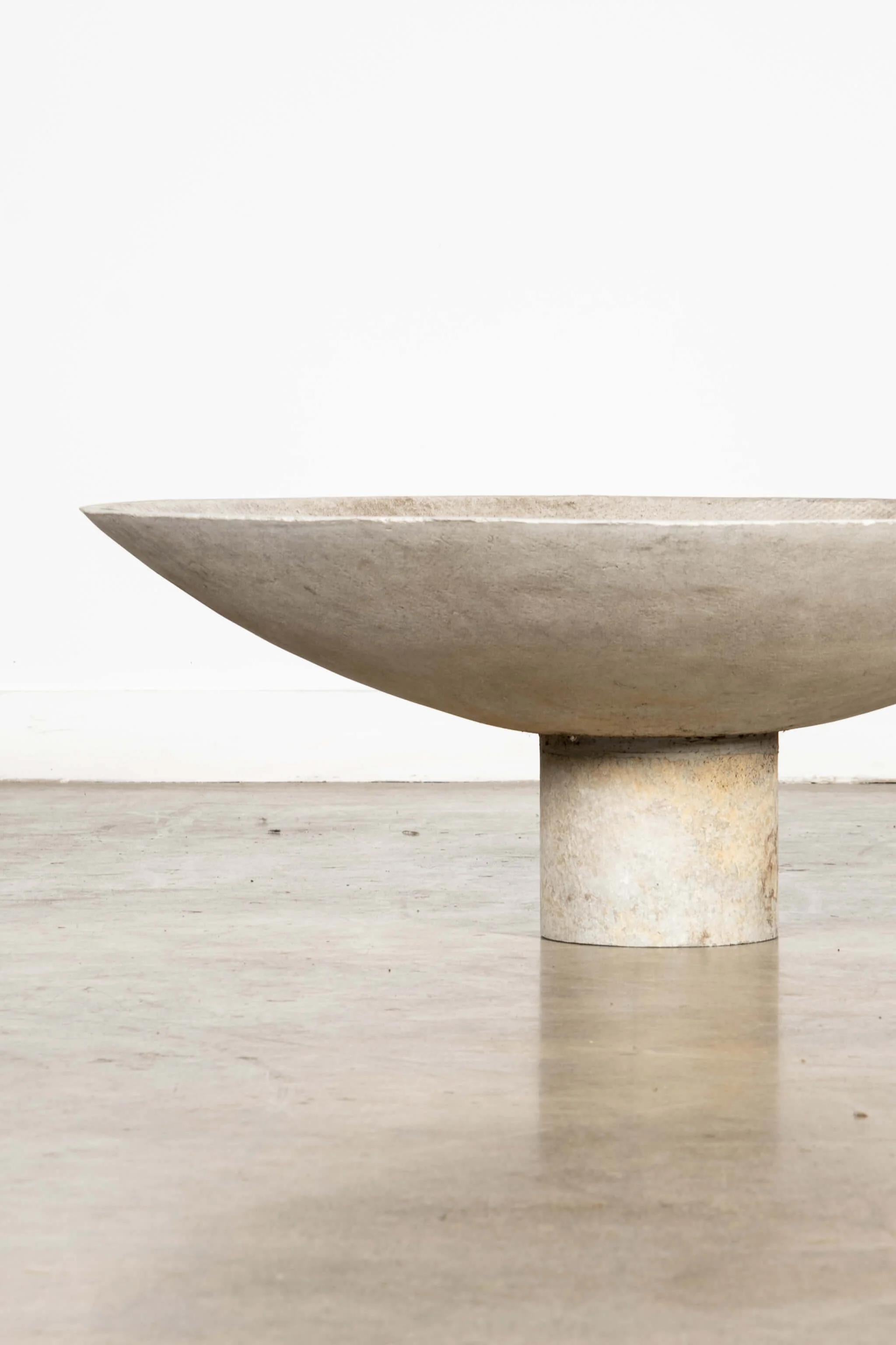 The large concrete composite saucer planter by Swiss architect Willy Guhl, provides a wide, low profile base for arrangements. Sculptural and suitable for indoor or outdoor use.

overall: 14.25