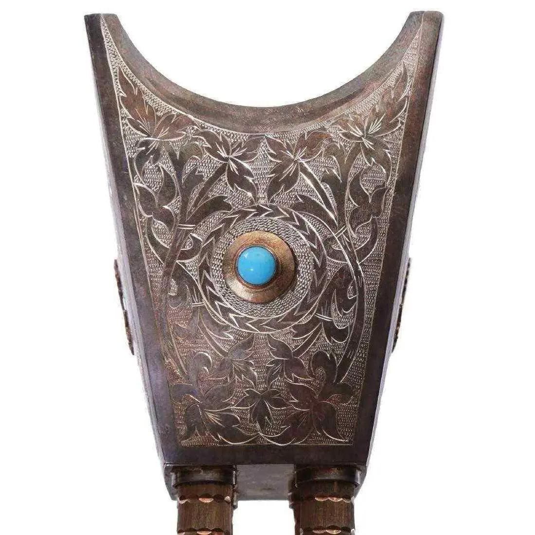 Saudi Arabian silver and gold incense Bukhur burner vase with turquoise and royal coat of arms.

Measures: 9