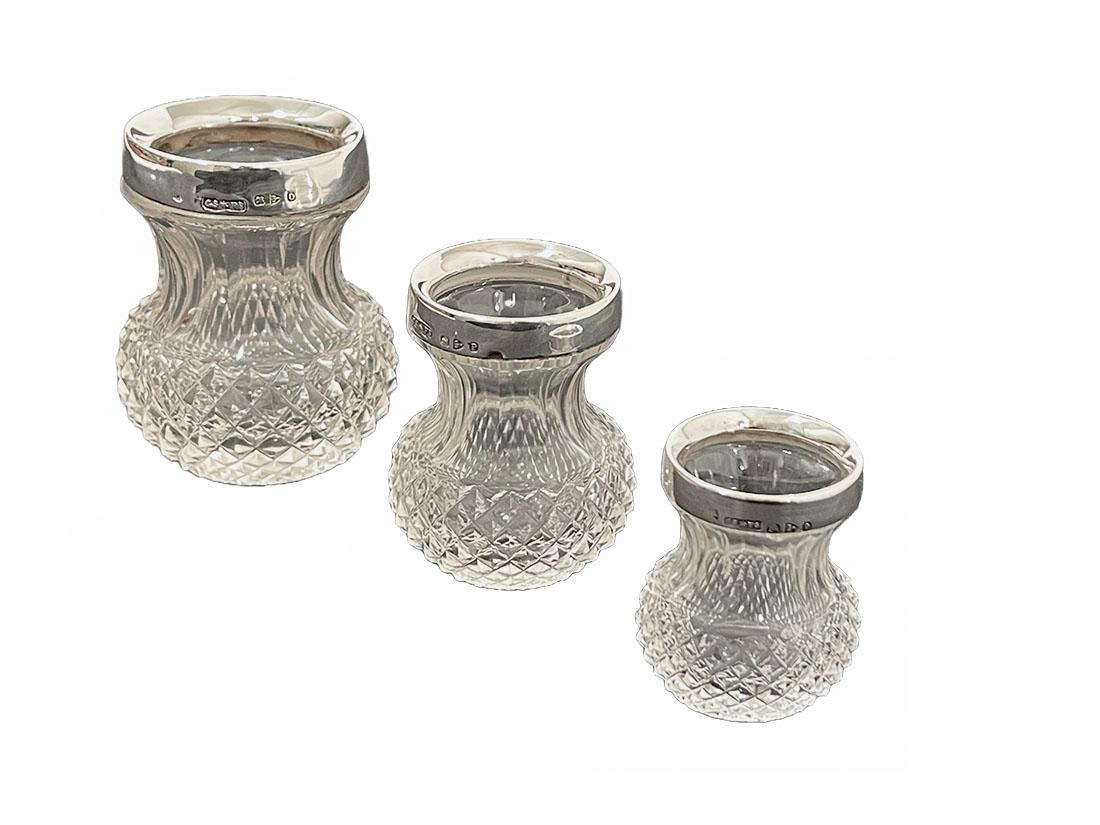 Saunders and Shepard crystal and silver very small vases, 1897

3 very small diamond crystal cut vases with silver ring, made by Cornelius Desormeaux Saunders and James Francis Hollings Shepherd 
These very small vases can be used on the table,