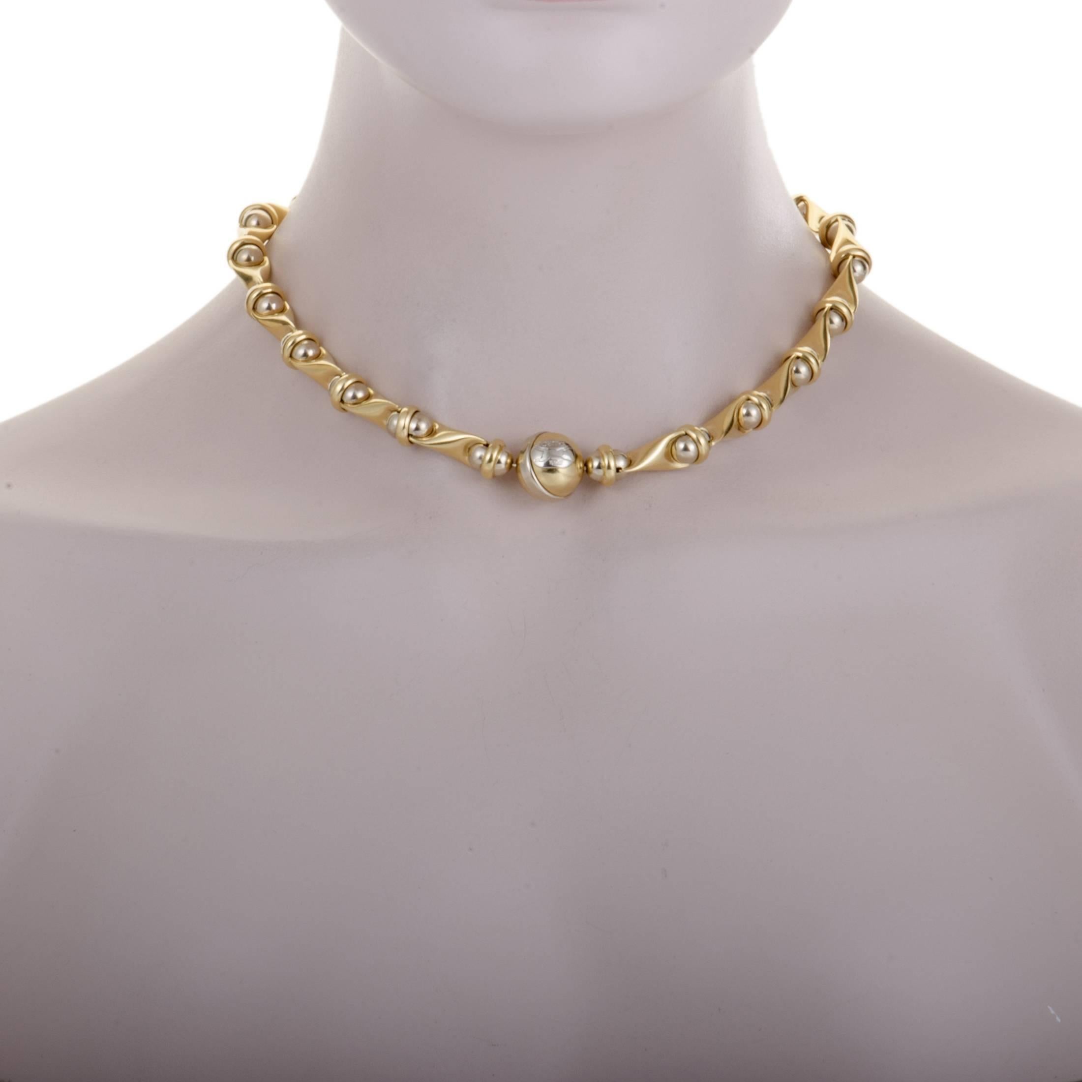 Featuring an extraordinarily bold design, this spectacular necklace offers an incredibly stylish appearance. Presented by Sauro, the necklace is crafted from the eye-catching combination of 18K yellow and white gold. 