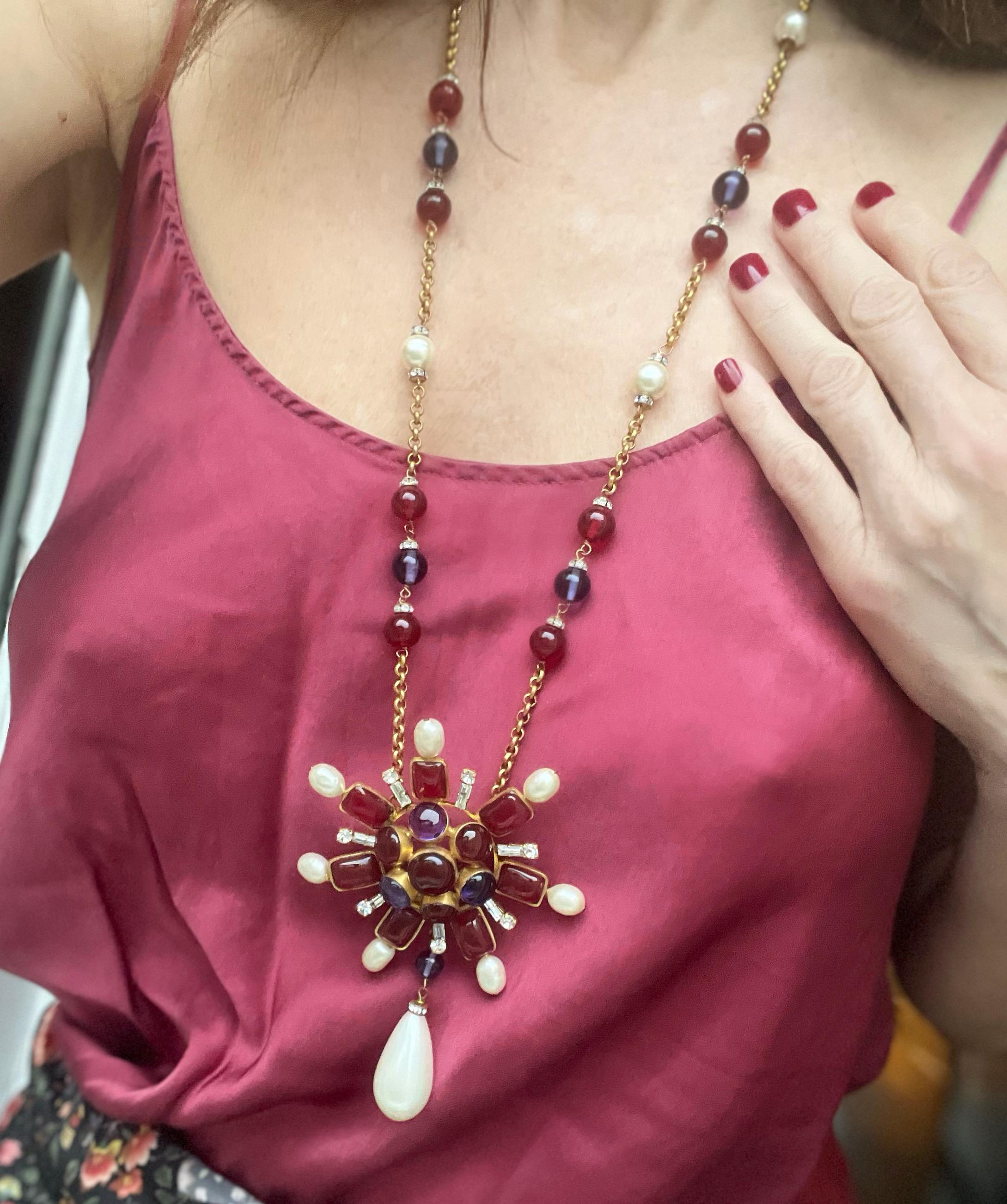 Sublime long Necklace Baroque Spirit made by Gripoix for Chanel in the 80S. Haute Couture Collection, unique piece it is ornamented with resin stones, baroque pearls and strass. Hues of purple, red and Bordeaux. This is a collectible piece. 