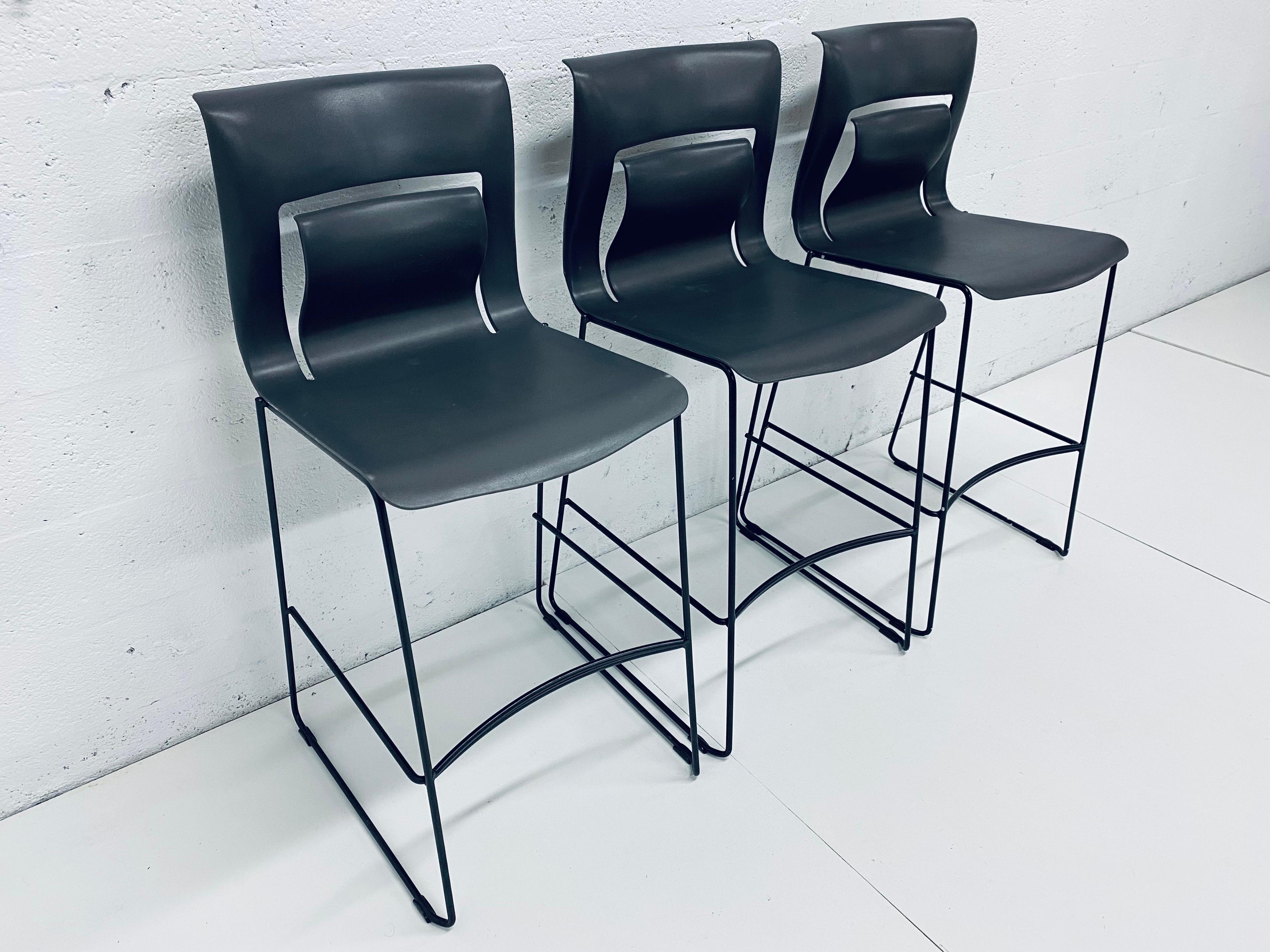 Set of three bar stools with moulded 