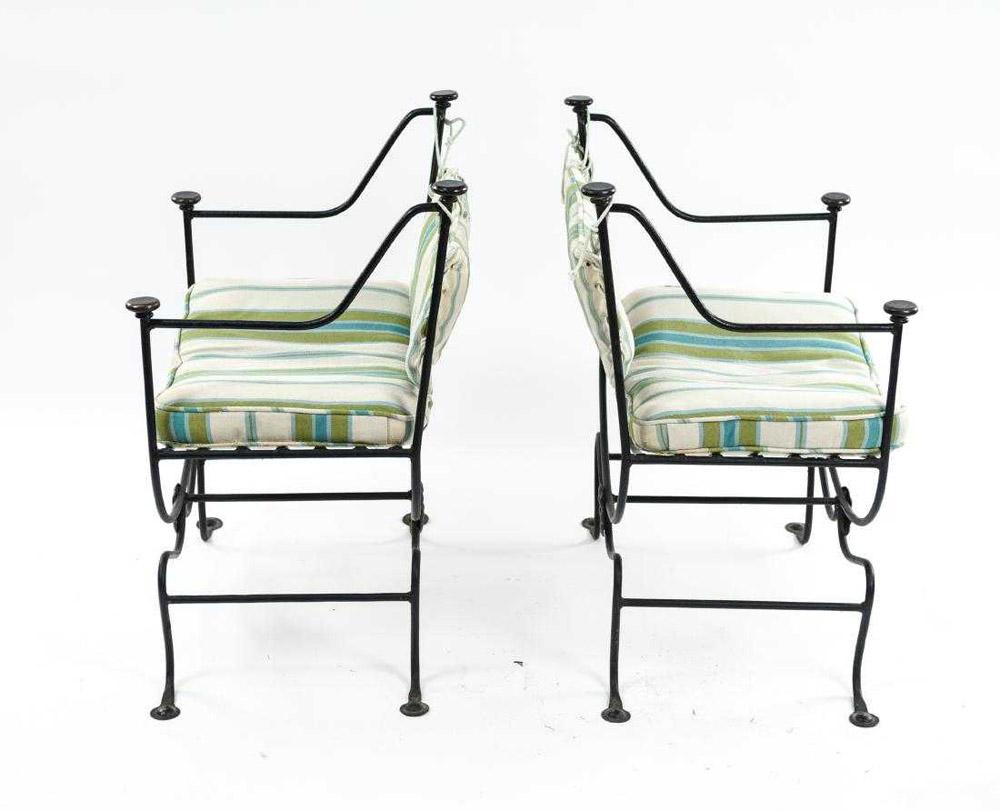 Italian Savonarola style chairs with wrought iron with blue green and white stripped loose cushion on seats.  Chairs c an be used indoor or outdoors. Great as end dining chairs with cushions and back support.  Cushions are in poor condition and are