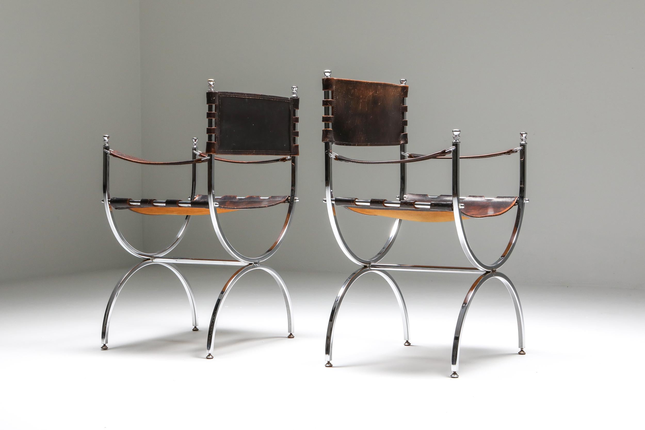 “Savonarola” Emperor pair of chairs by Maison Jansen, 1970s.

Luxury Maison Jansen armchairs with elegant chrome frames
and beautifully patinated thick brown leather, seats, back and armrests.
Produced in France during the 1970s.
The chairs are