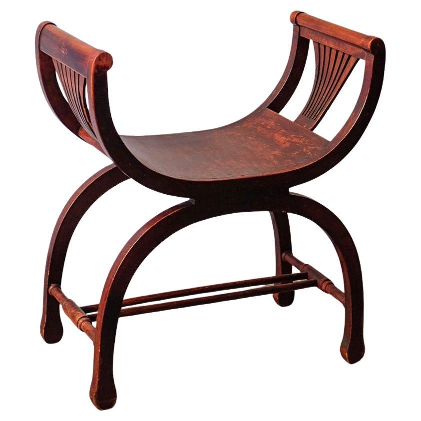 Taburete curvo estilo Savonarola en venta