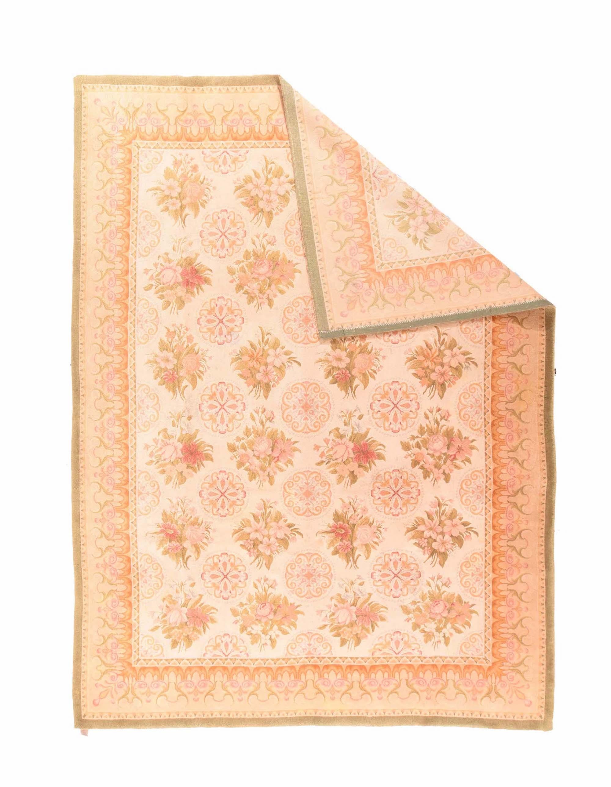 Savonnerie Rug 8’9” x 12’1”. Woven sideways. This scatter in the European needlepoint rug style features a creamy straw field with columns of realistic floral bouquets, with secondary columns of petal and volute round rosettes, detailed in: