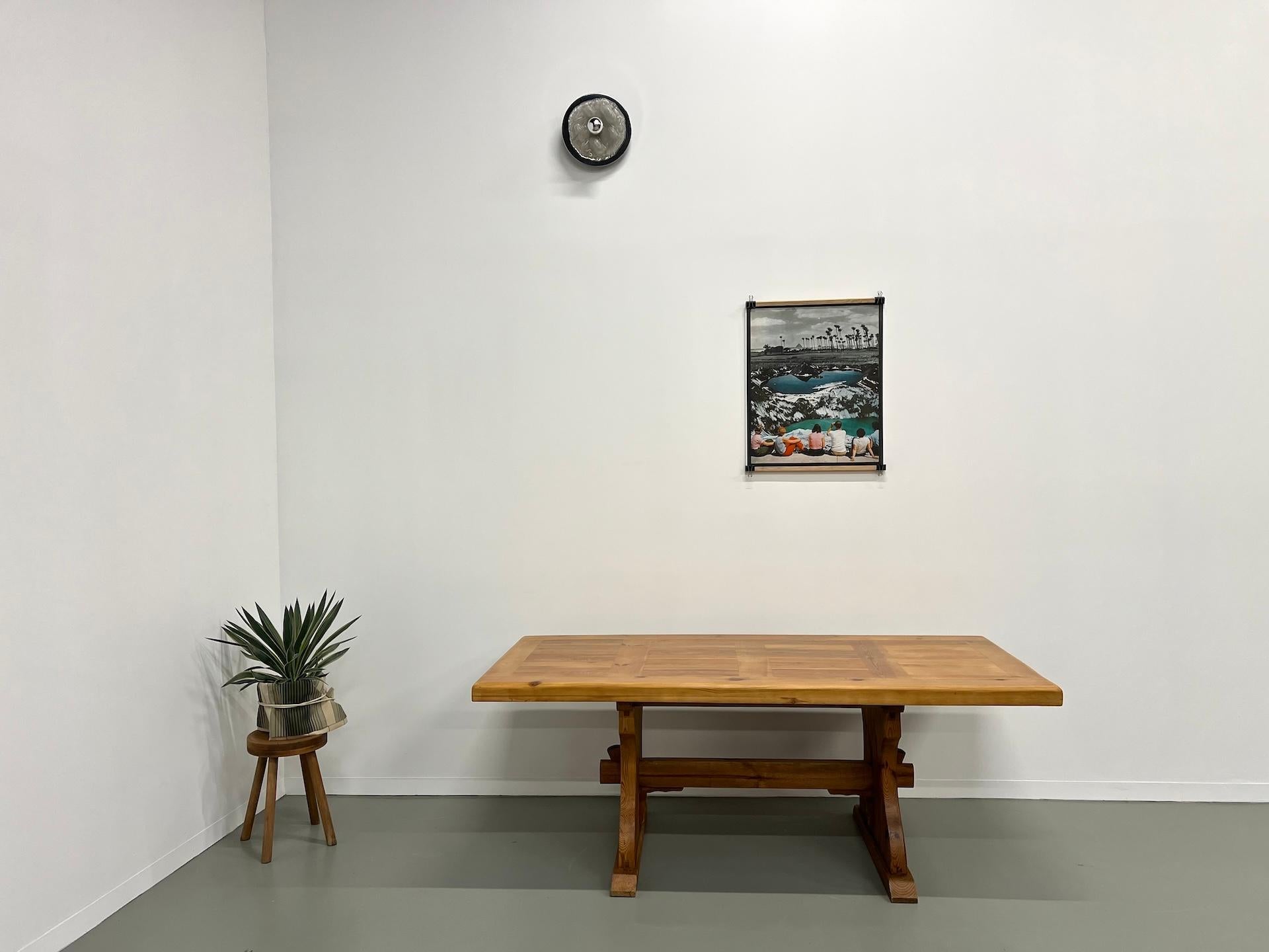 Maison Lecan presents this fairly light table given its size and its monastery spirit. It is solid pine lightened in certain places (under the top and the feet) to make it lighter. We have preserved the patina of the base and completely restored the