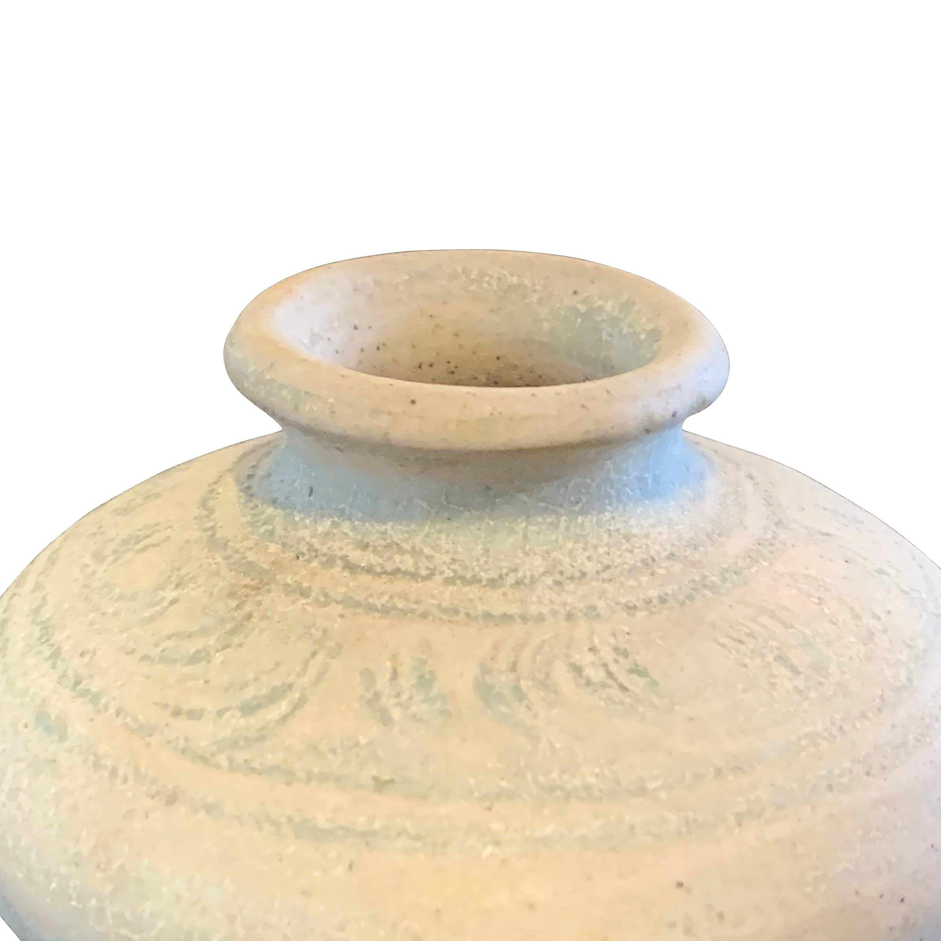 16th century pottery from the Sawankhalok district in the Sukhothai which is a provence of Thailand.
This small pot has a faded hand painted grey design and a natural aged patina.
We have a collection of small pots from Asia which are sold
