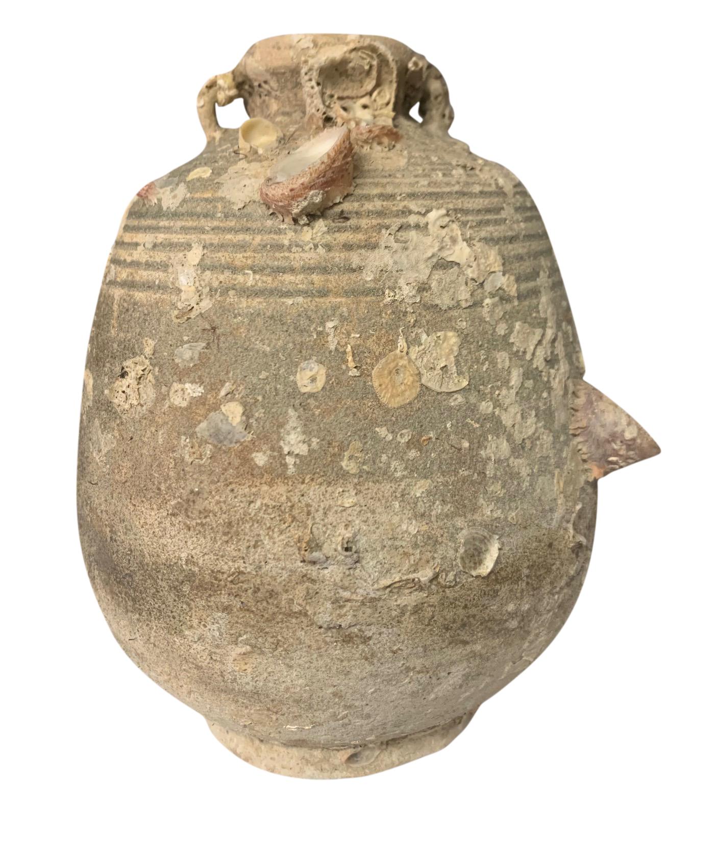 16th century Thailand Sawankhalok vessel from the Turiang shipwreck discovered in 1998 in the South China Sea.
Natural marine growth from being submerged for over 300 years.
From a large collection of vessels that survived and have been discovered.