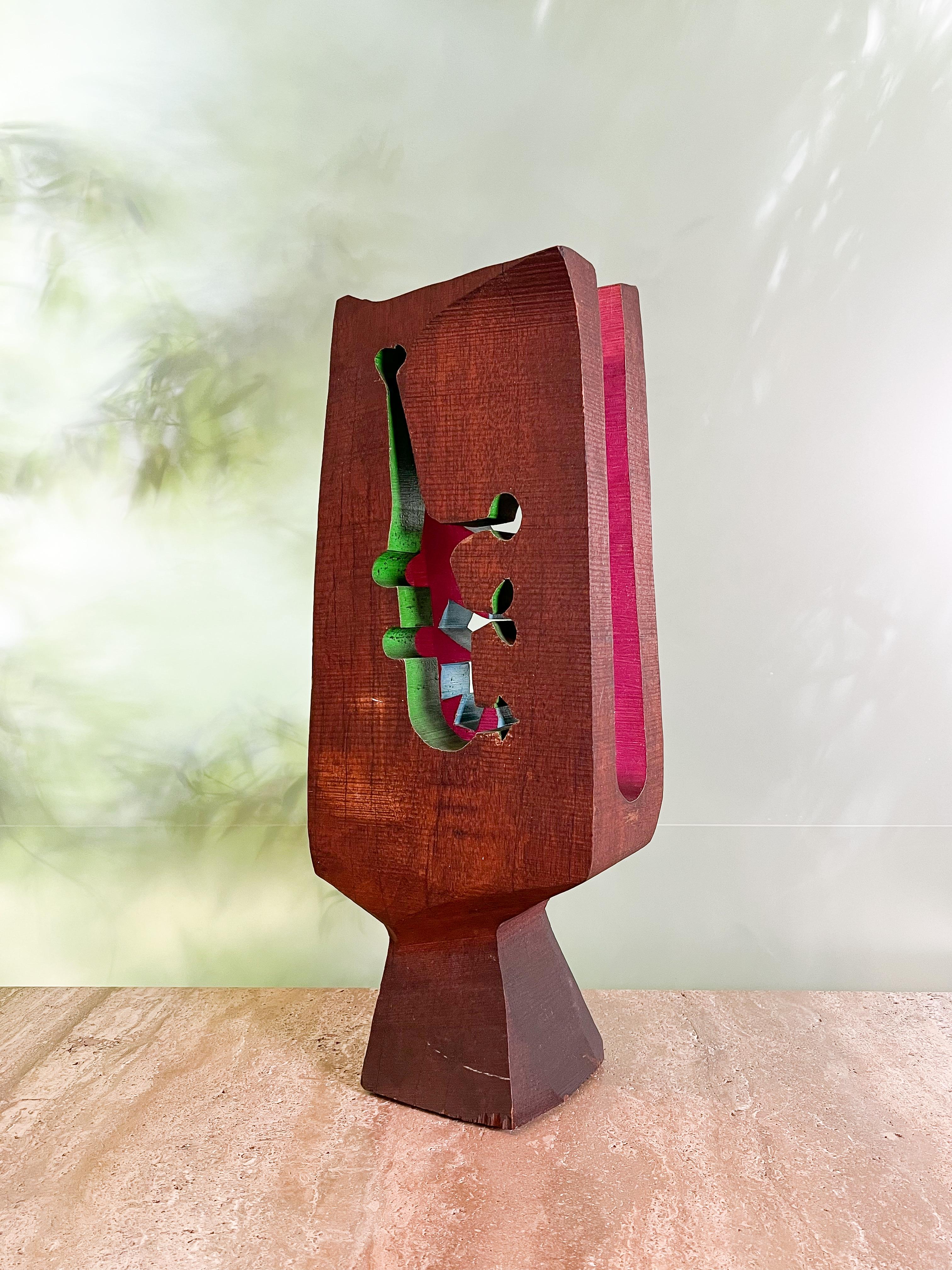 Stained and polychromed, this sawn oak sculpture by American artist Hugh Townley (1923-2008) dates from 1957. Contrasting splashes of color flash through the cutout abstract forms for which the artist is known. Stamped 