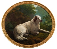 An English setter reclining in a landscape