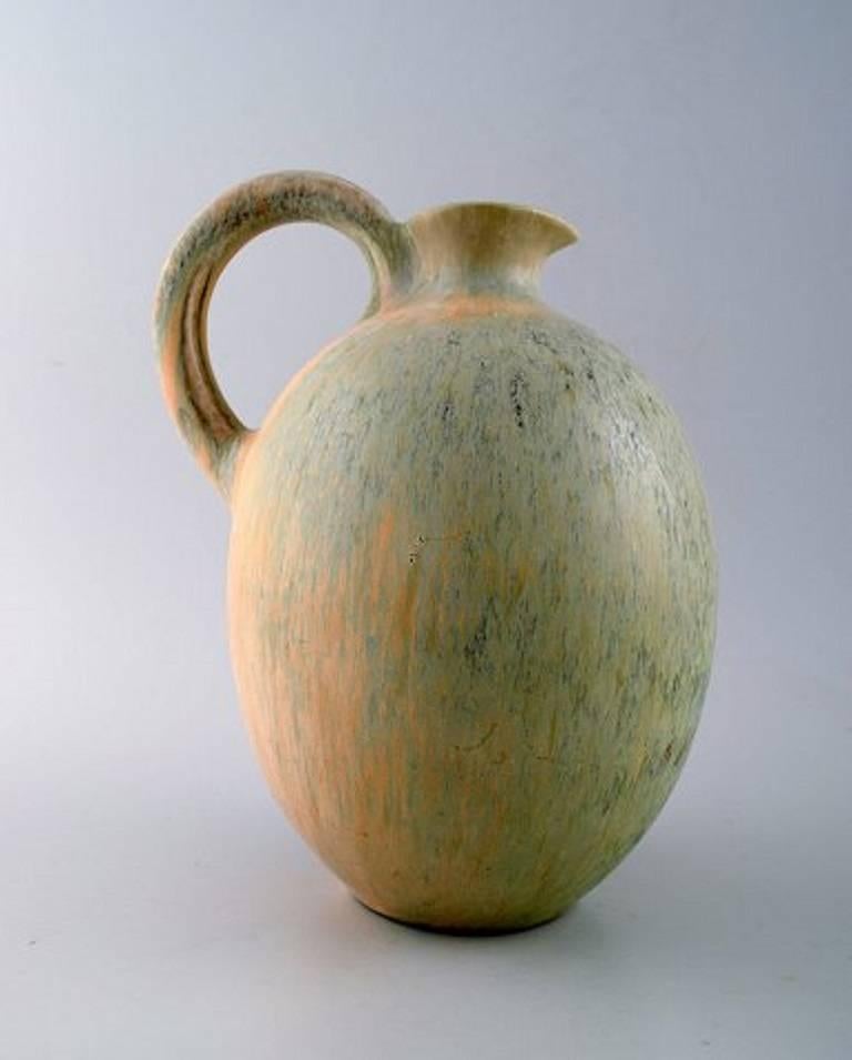 Saxbo, ceramic jug, beautiful glaze.
Stamped. Ying yang.
In perfect condition.
Measures 22.5 cm x 15 cm.