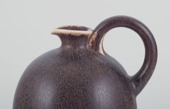 Saxbo, Denmark. Large ceramic jug with glaze in shades of brown.