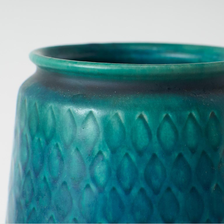 A teal Saxbo vase, with a scale-like pattern in relief. 
Stamped Saxbo.
 